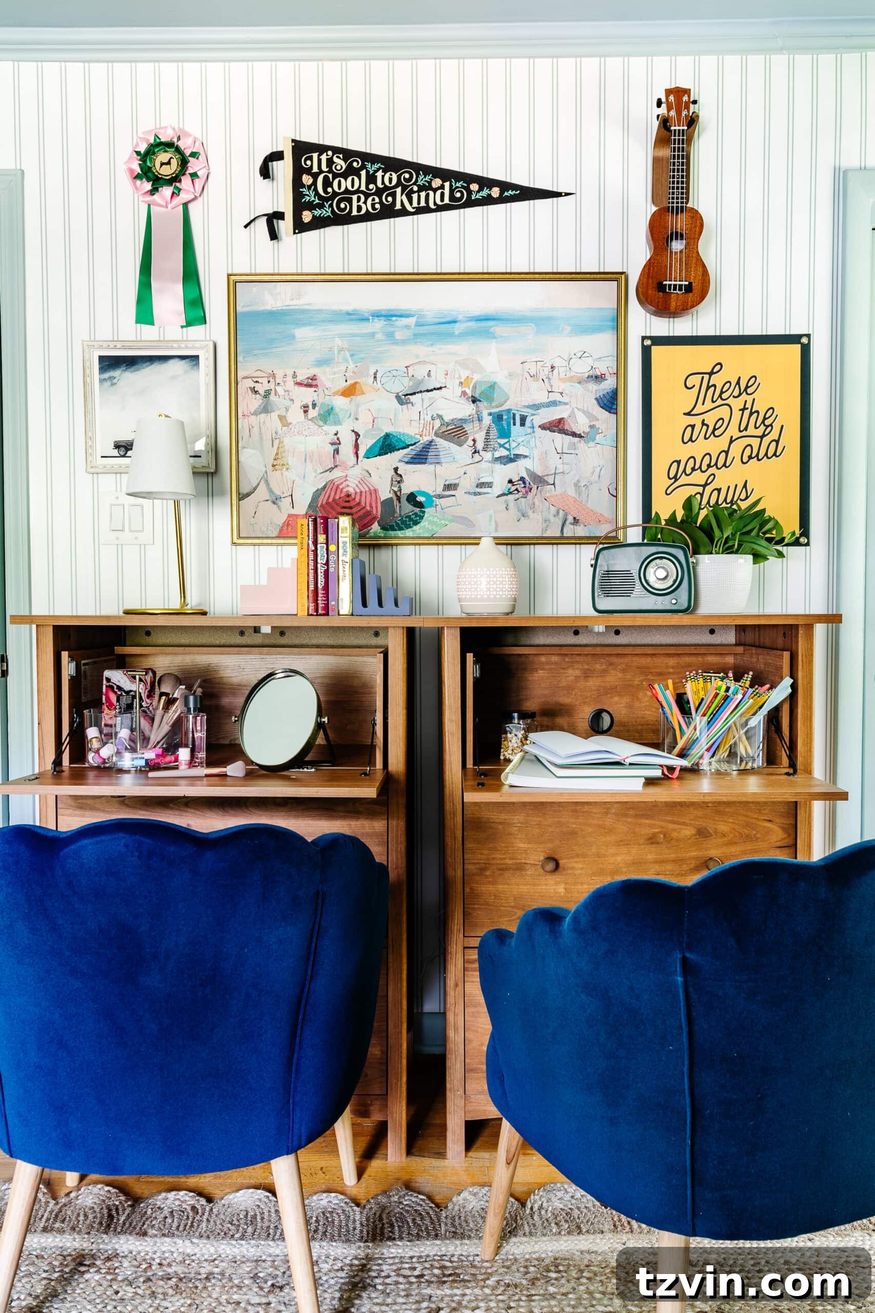 Beach bedroom gallery wall featuring camp art and coastal paintings above bedroom desks