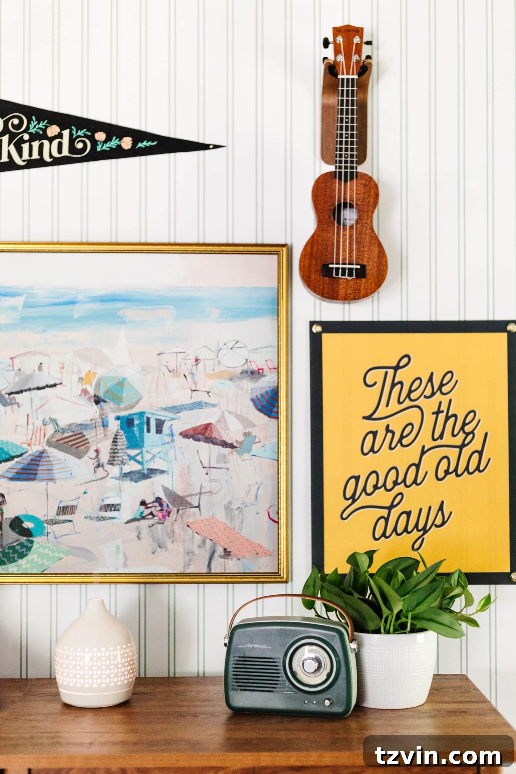 Wireless speaker radio on dresser with gallery wall in a teenage beach themed bedroom