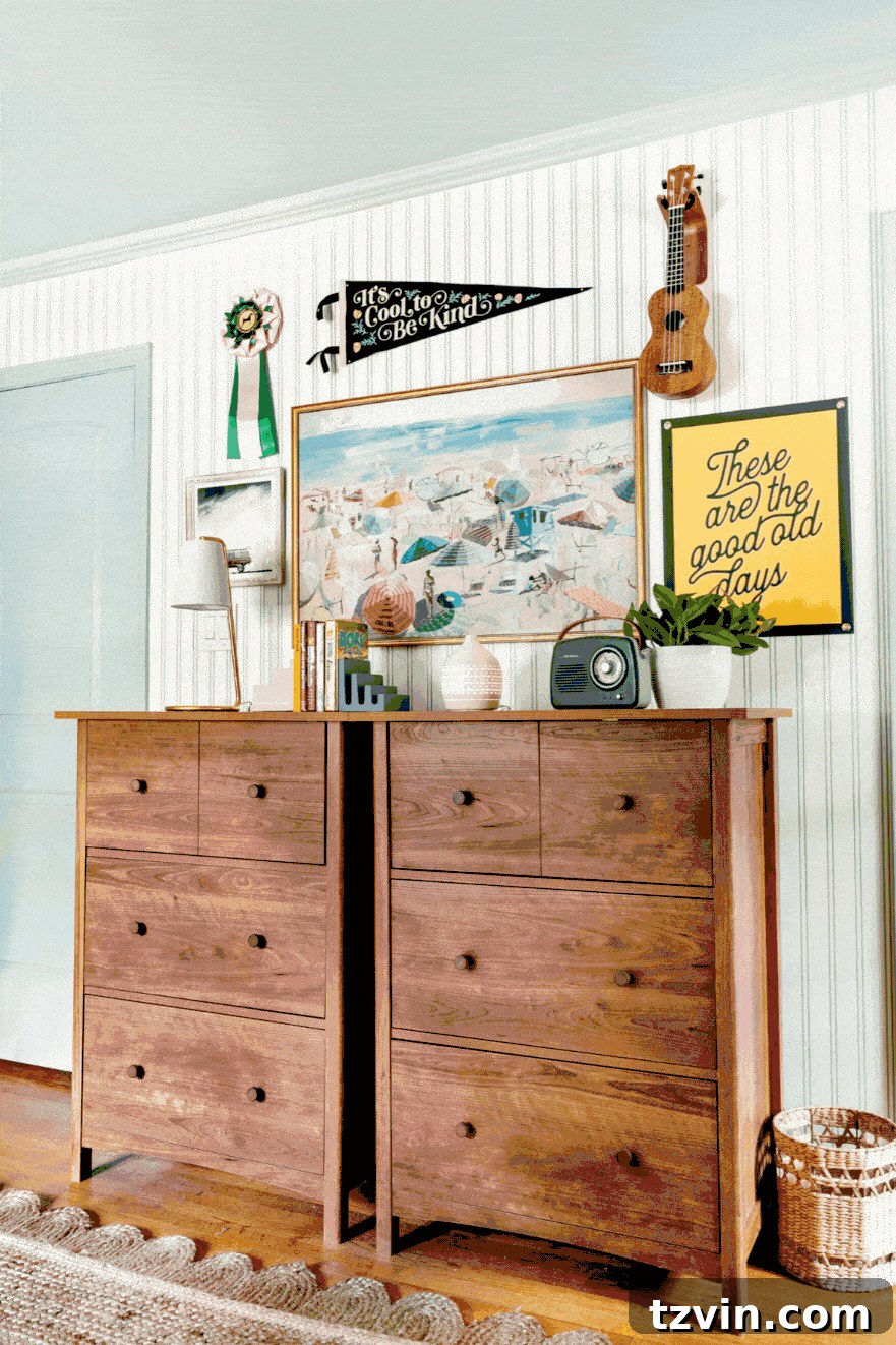 Stylish dresser desks in a shared teenage bedroom featuring coastal wall decor and playful camp art
