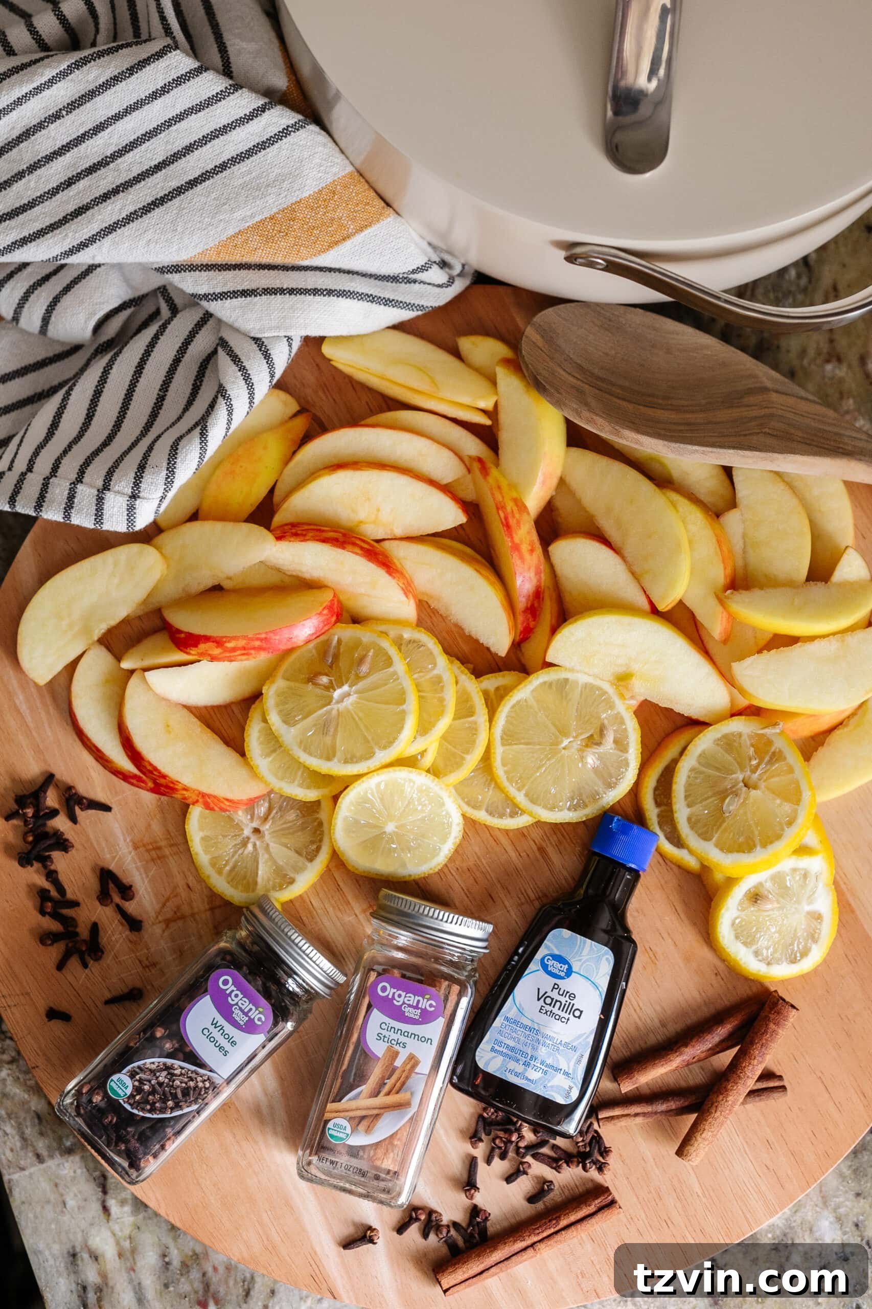 apples, lemons, cloves, cinnamon sticks, and vanilla extract for DIY stovetop potpourri