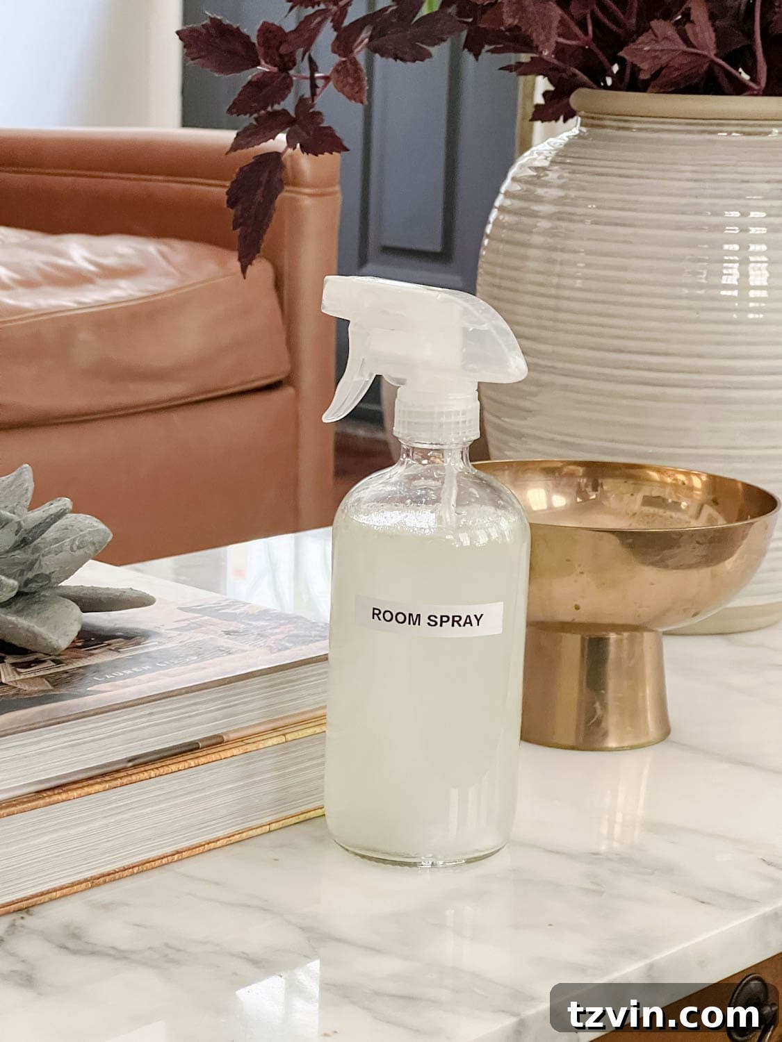 spray bottle of room spray on a living room coffee table