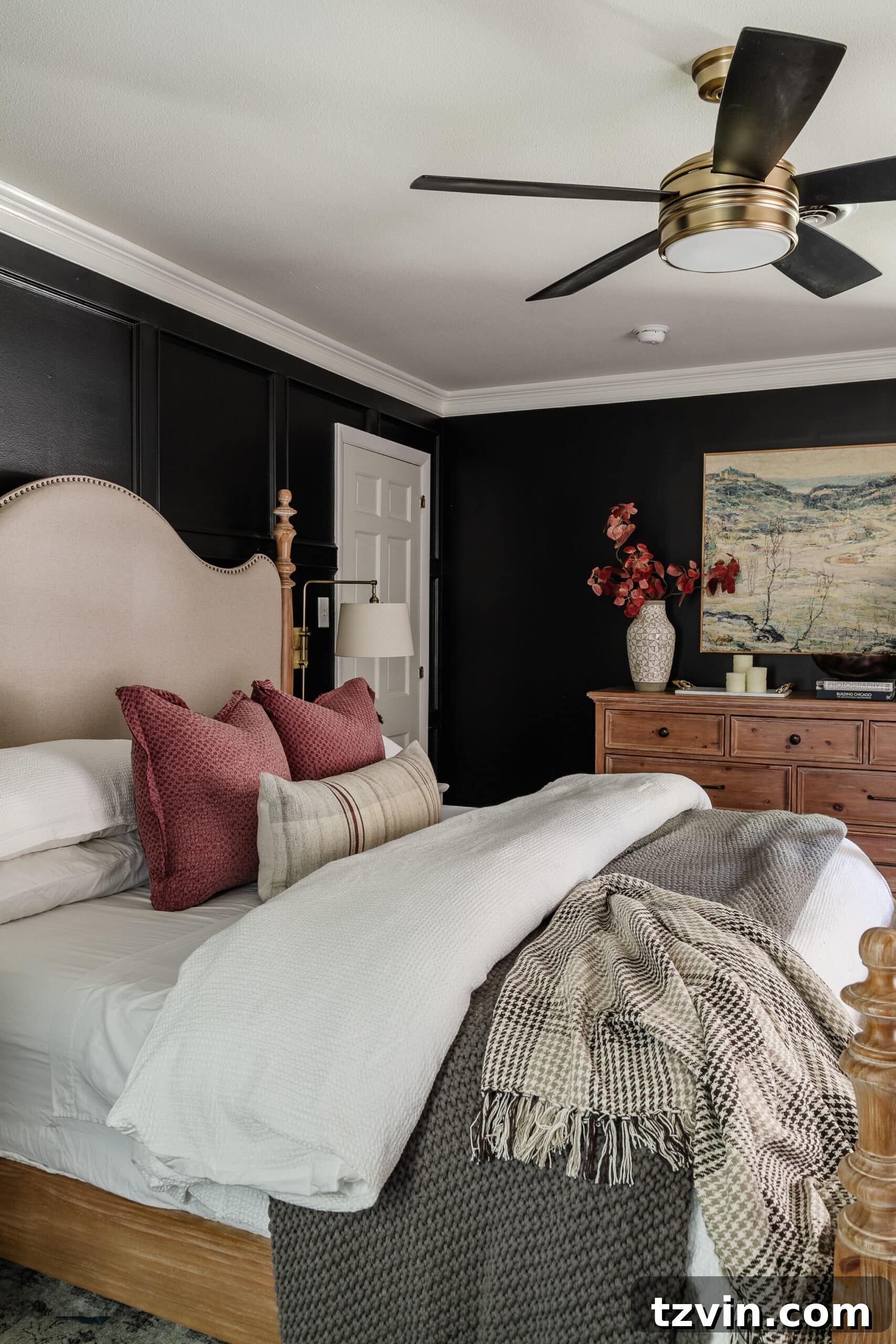 10 Budget-Friendly Ways to Create a Cozy Sleep Haven 2 cozy bedroom with black walls, comfy bedding, and wooden dresser