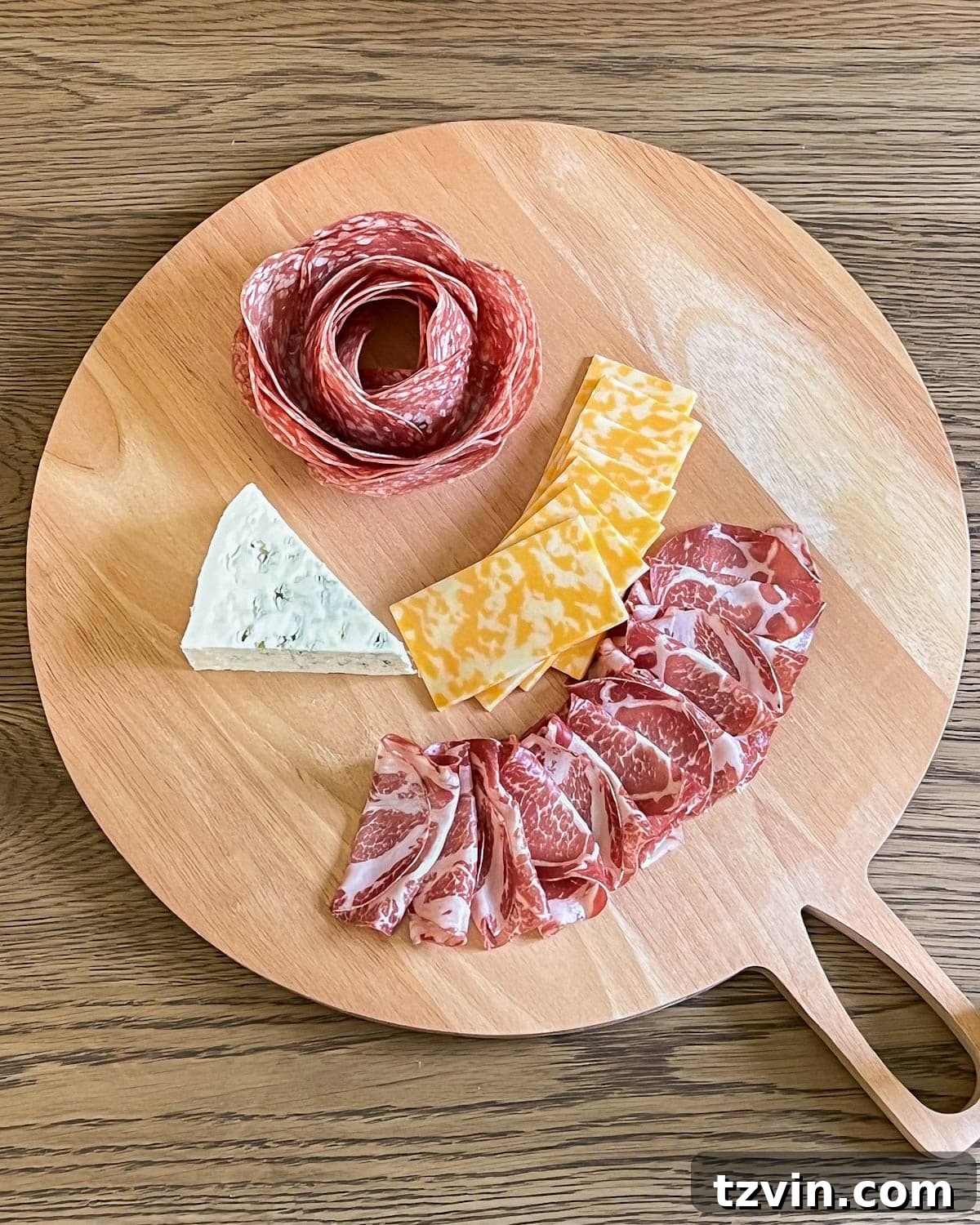 simple charcuterie board with cured meat and cheese added
