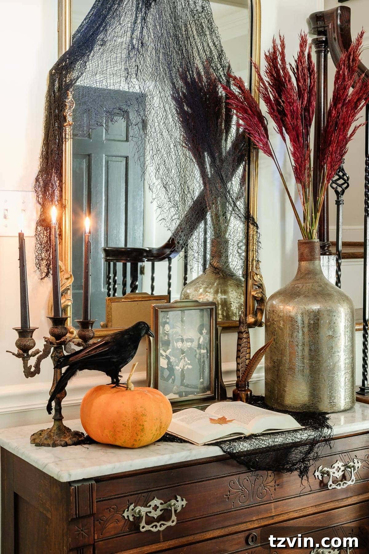 Hauntingly Chic: 30 Vintage Halloween Decor Must-Haves 2 entry table with vintage Halloween decor for a spooky elegant style vignette