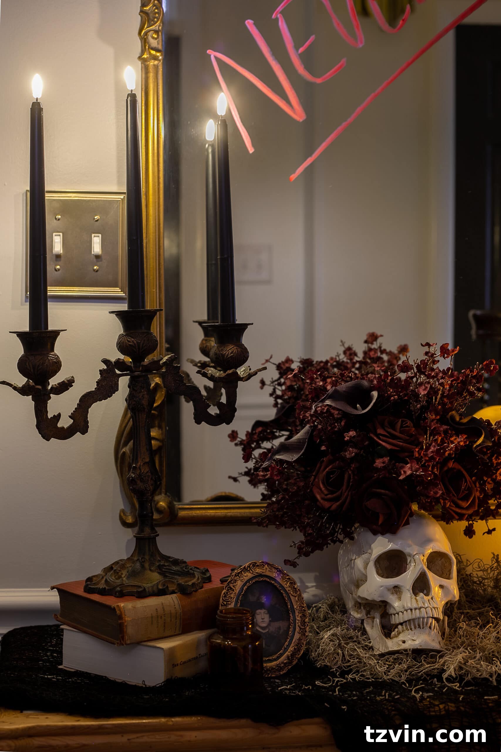 DIY Foyer Frights: Haunted Halloween Welcome 11 candelabra with flameless candles, vintage picture frame, and skull vase
