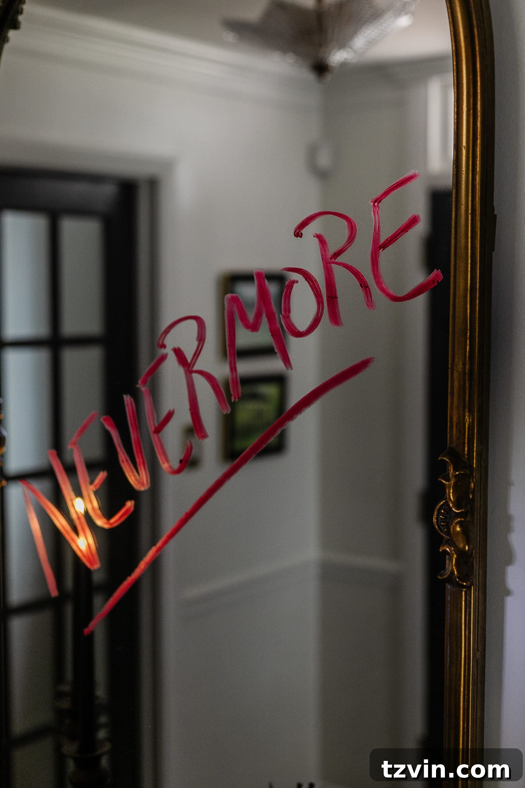 DIY Foyer Frights: Haunted Halloween Welcome 12 Nevermore written on mirror in red lipstick
