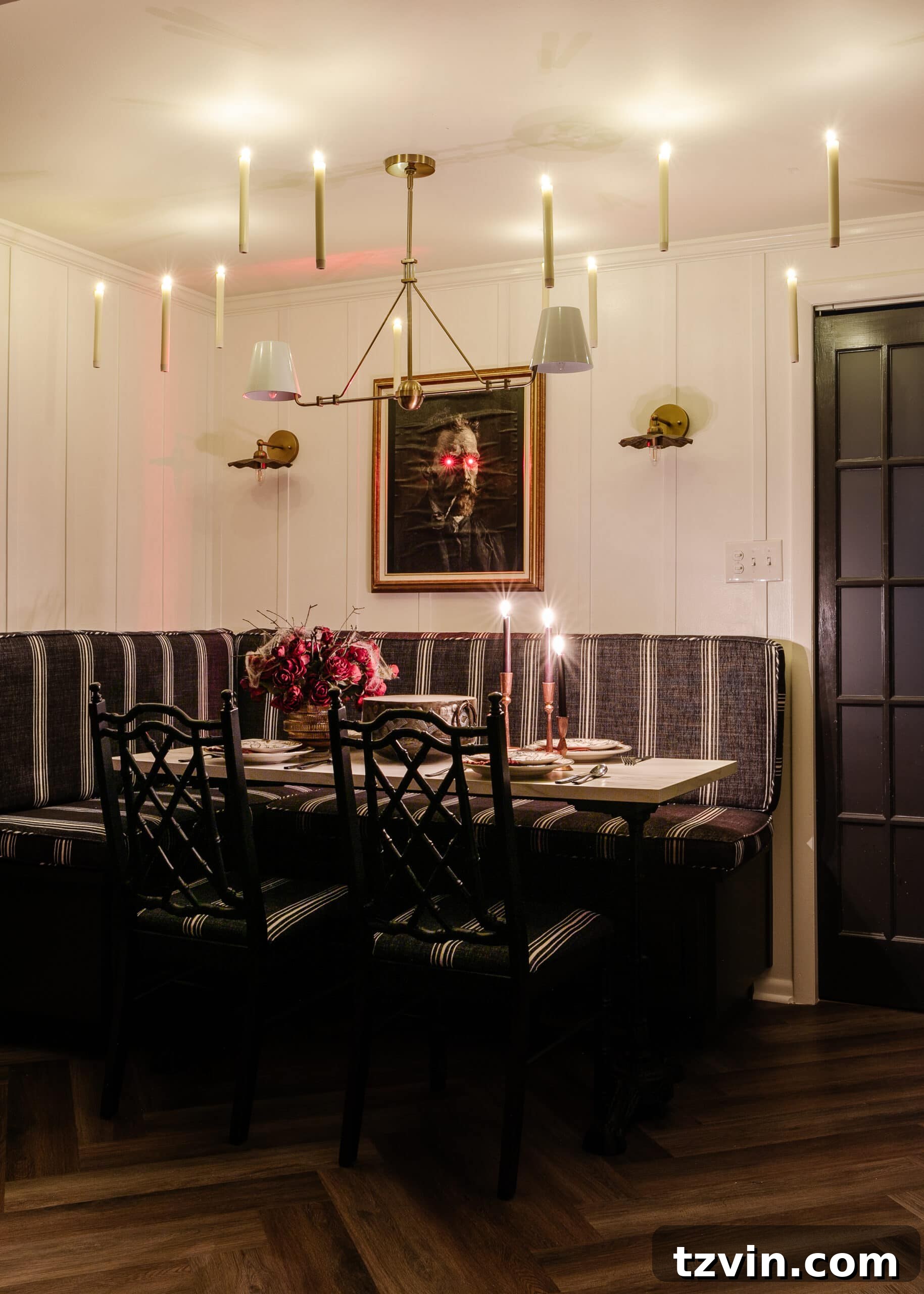 Killer Tablescapes: Spooky Settings for Your Murder Mystery Party 3 Murder mystery dinner party table setting with gothic art portrait, floating candles, and elegant dinnerware