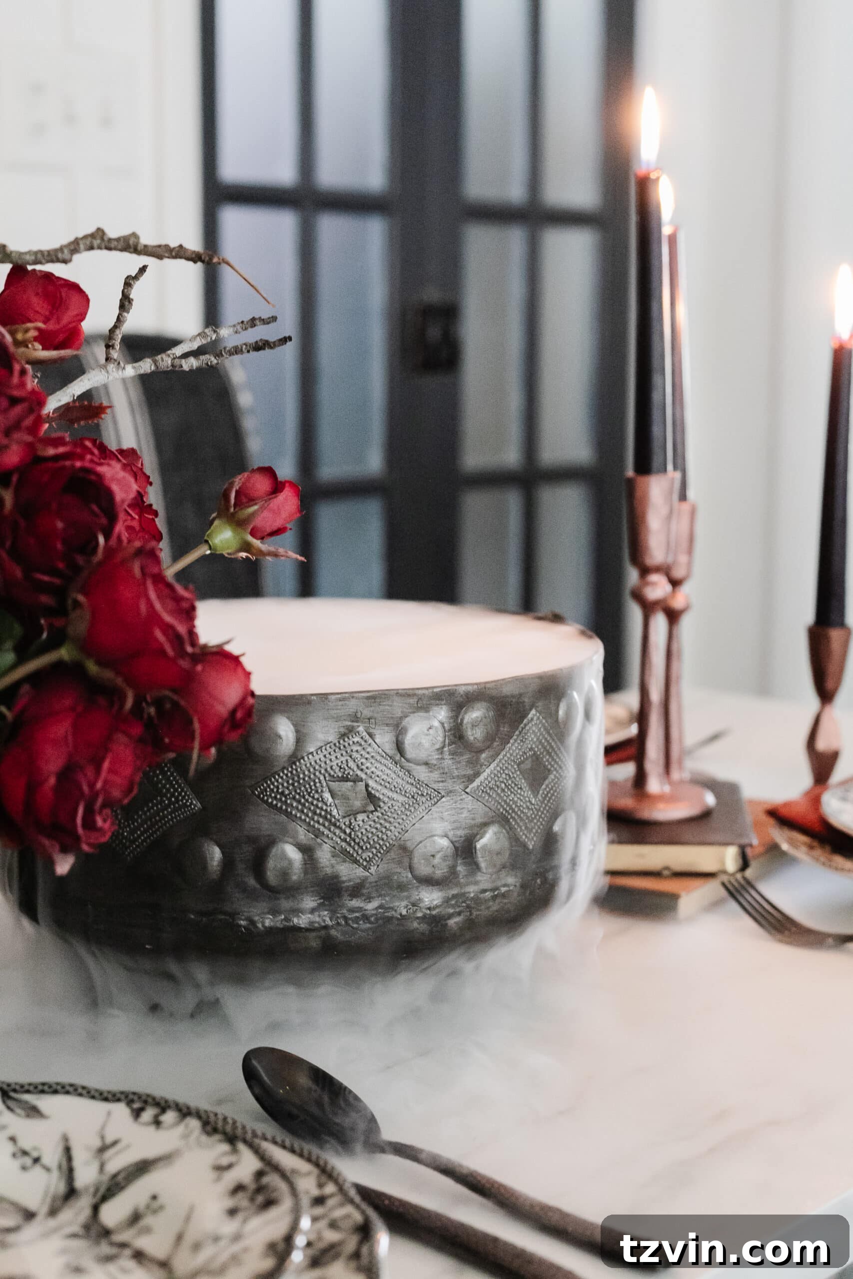 Killer Tablescapes: Spooky Settings for Your Murder Mystery Party 9 Murder mystery dinner party's simple Halloween centerpiece, featuring a cauldron with dry ice and hot water creating dramatic fog