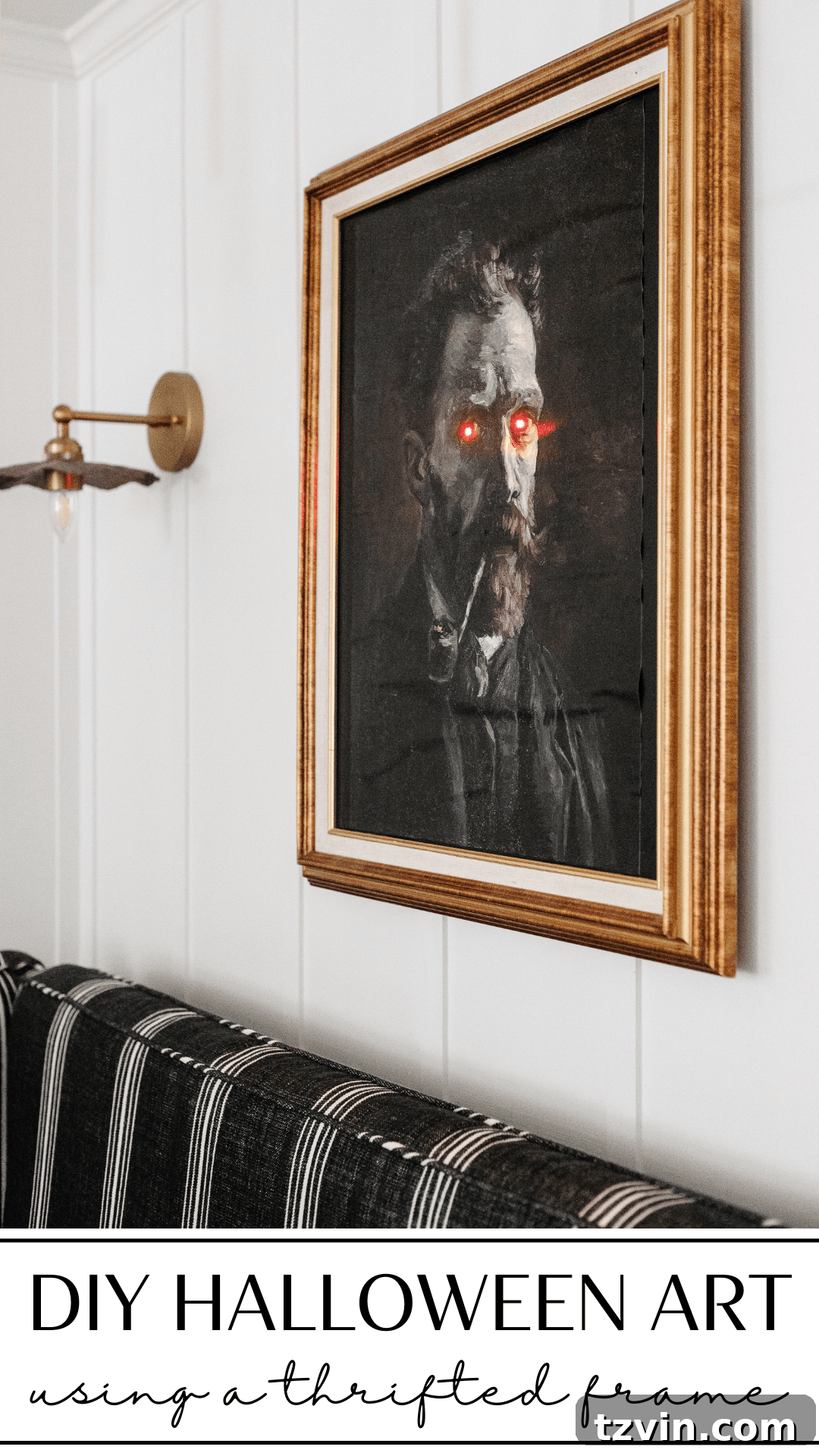 DIY creepy Halloween art in a thrift store frame with glowing eyes