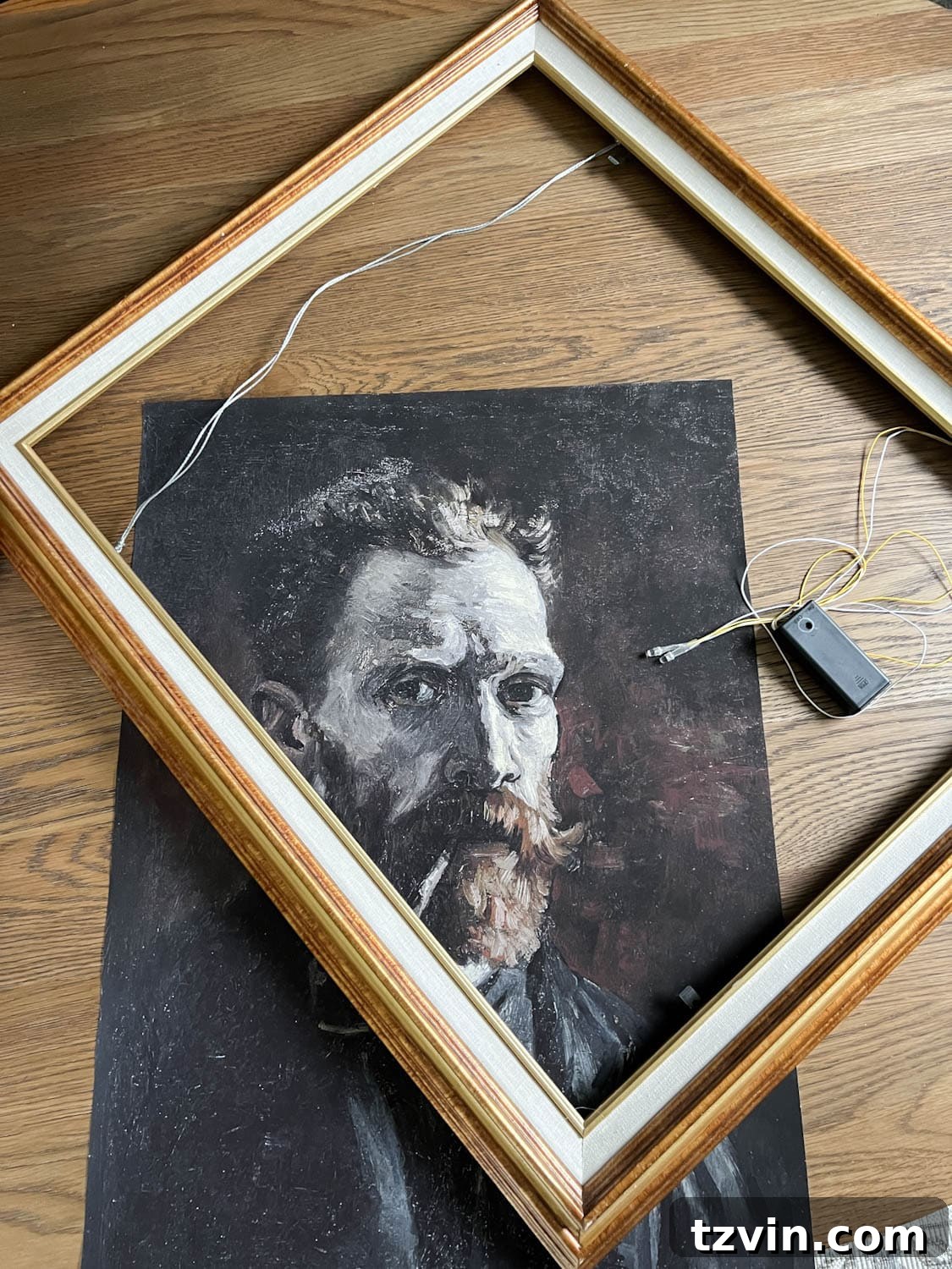 thrifted picture frame, art print, and battery operated lights