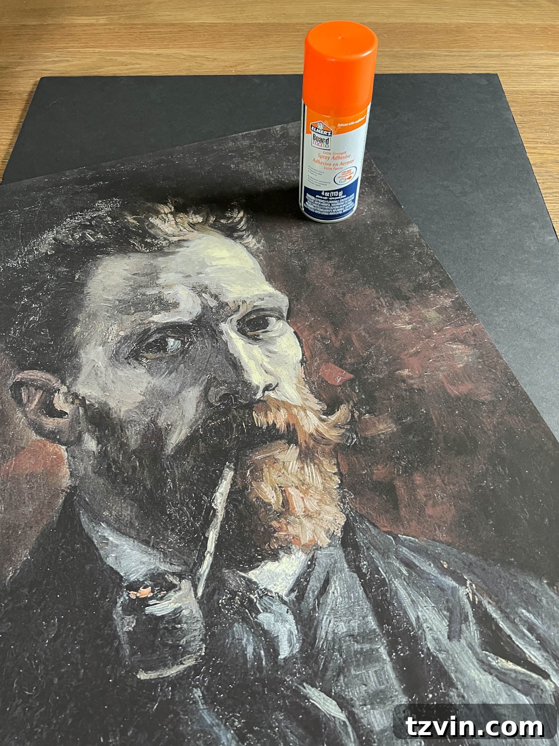 making creepy art by using spray adhesive on foam board