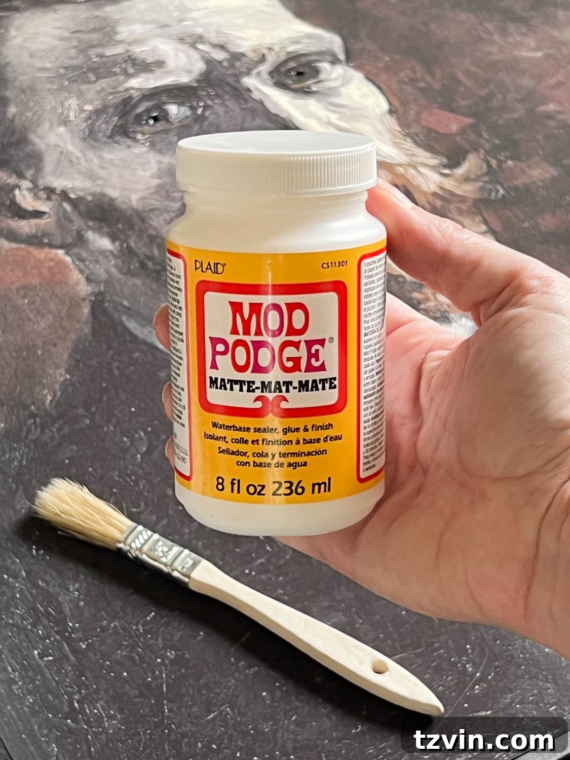 Matte Mod Podge brushing on art print