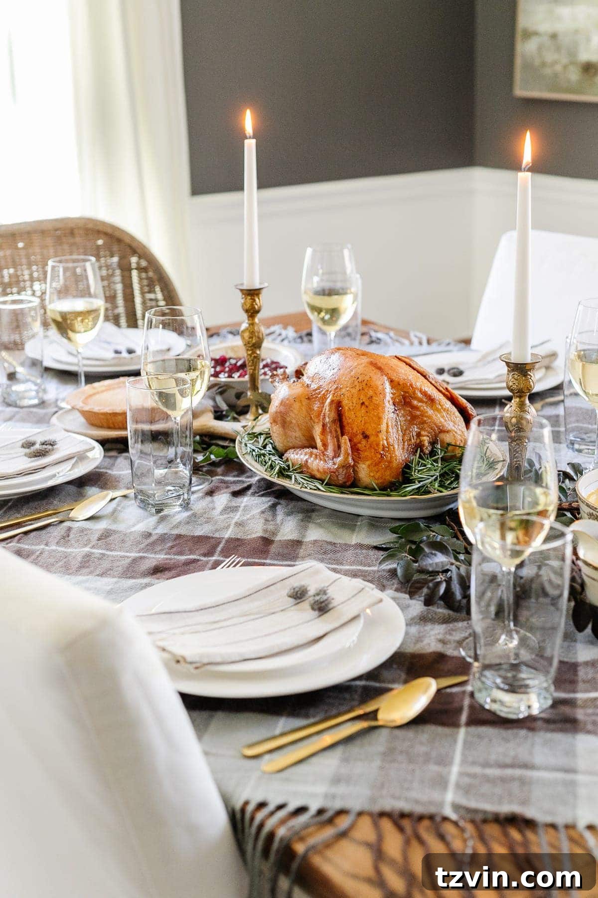 cheap Thanksgiving table decor with a throw blanket repurposed as a tablecloth