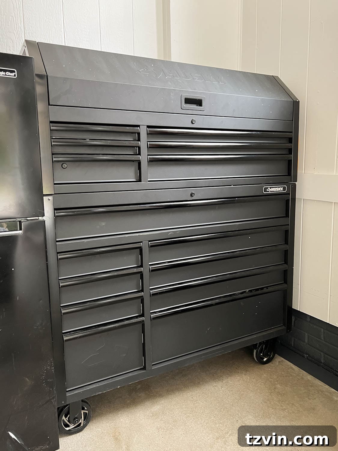 A rolling tool chest used as a comprehensive garage storage solution, showcasing its various compartments.