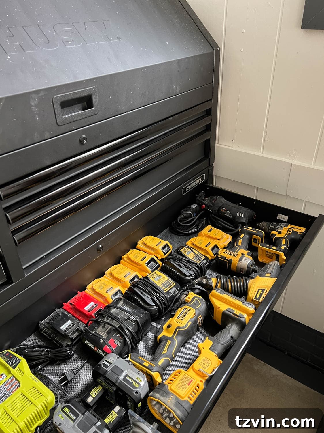 Interior view of a power tool garage storage solution within a tool chest, highlighting organized compartments.