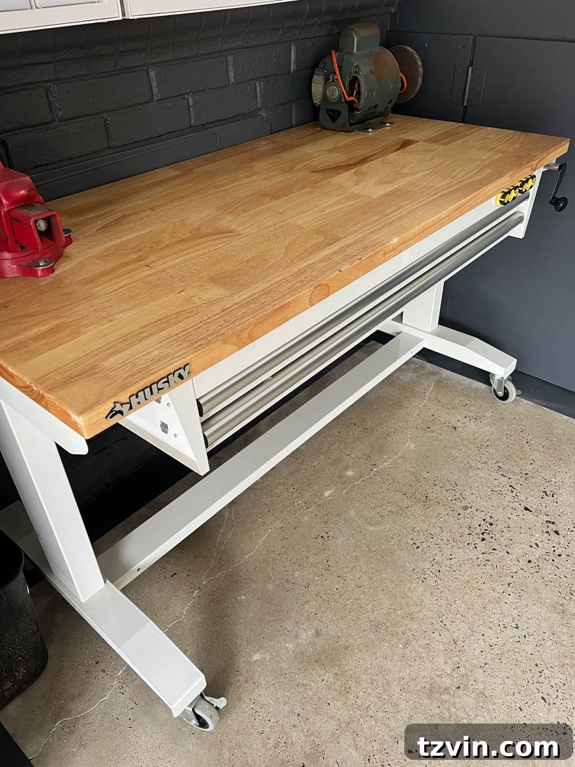A rolling workbench with built-in storage drawers, highlighting its practical design.