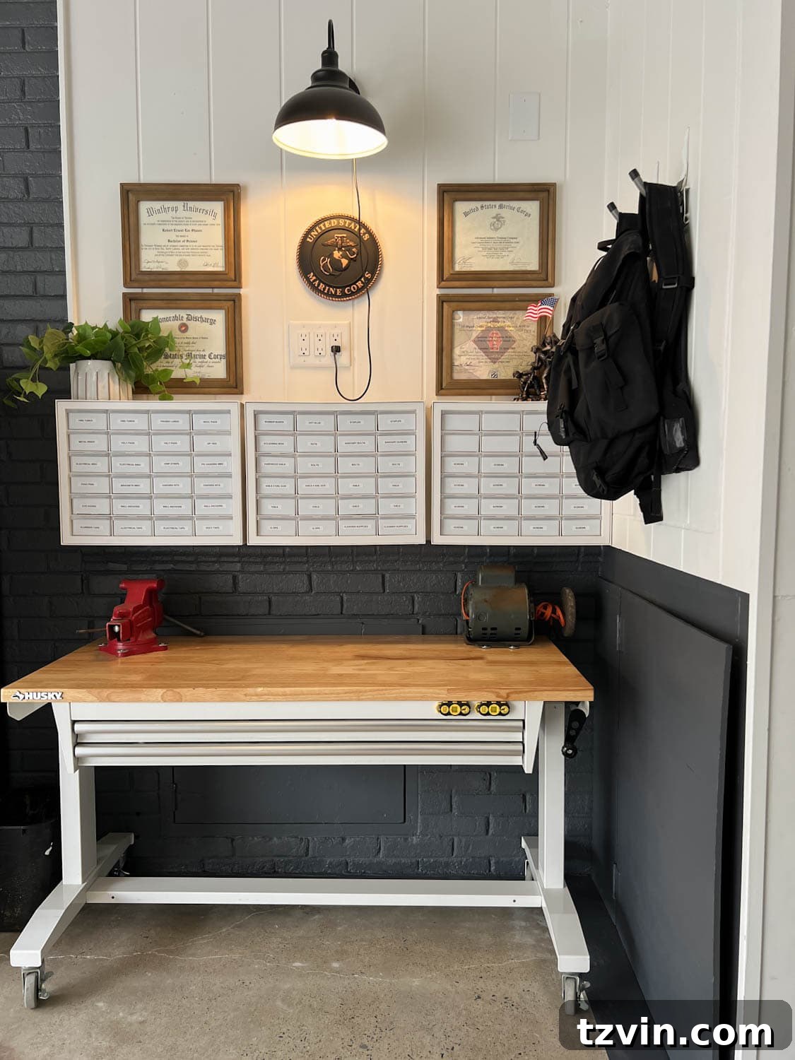 A well-organized garage workshop or 'man cave' area after a makeover, featuring a workbench and efficient storage.