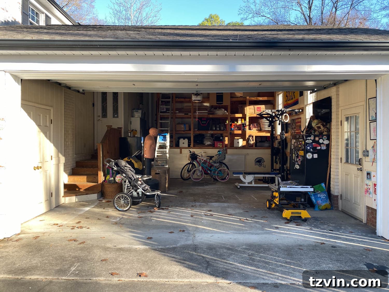 Before photo of a disorganized and cluttered garage, emphasizing the extent of the needed transformation.