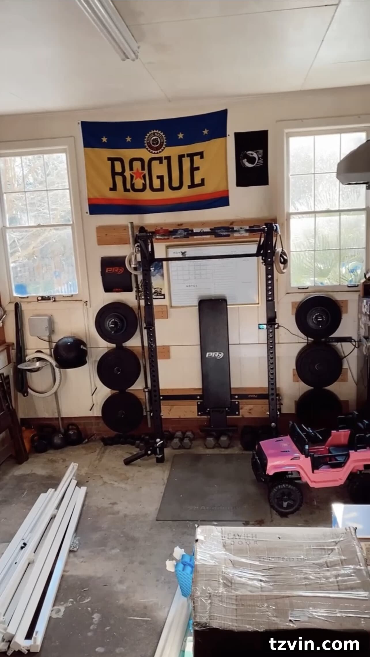 A section of the garage before organization, showing a jumble of sports equipment and other items.