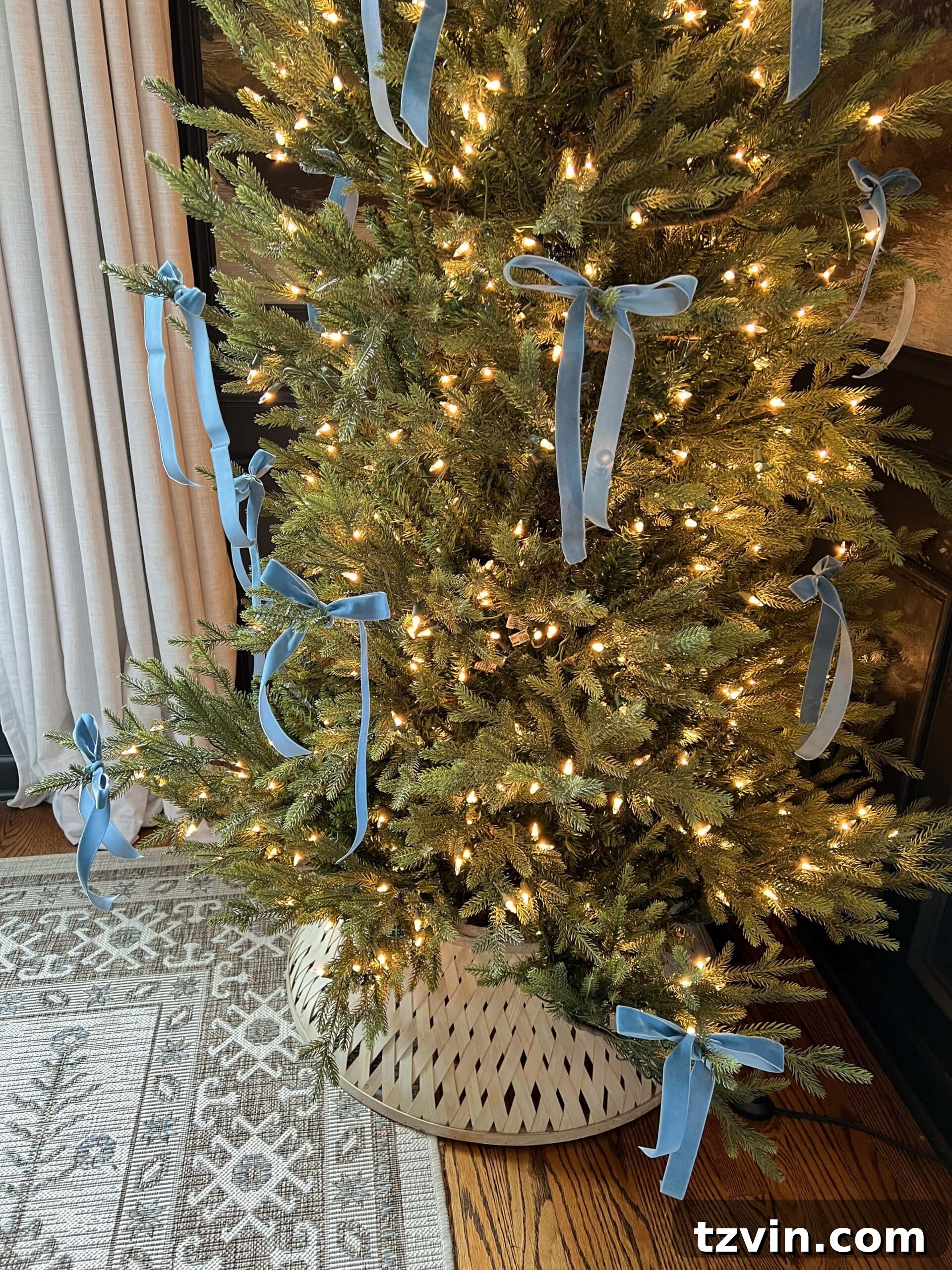 blue Christmas tree bows tied on branches