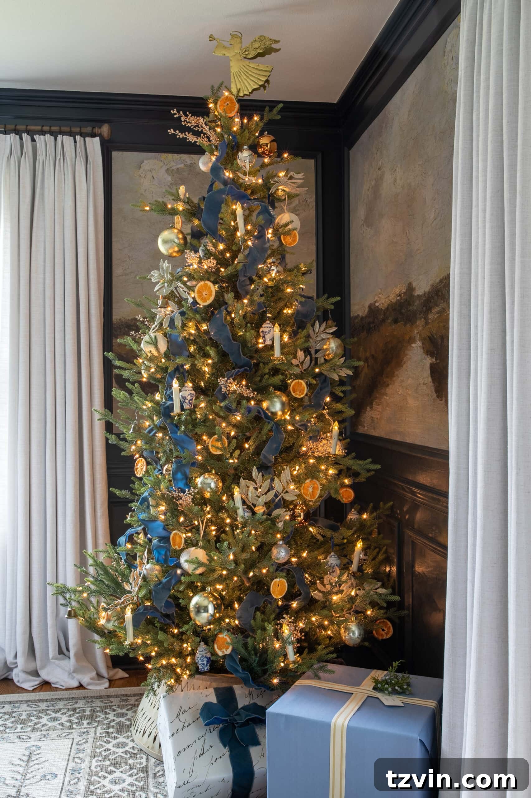 blue tree ribbon with dried oranges and gold ornaments