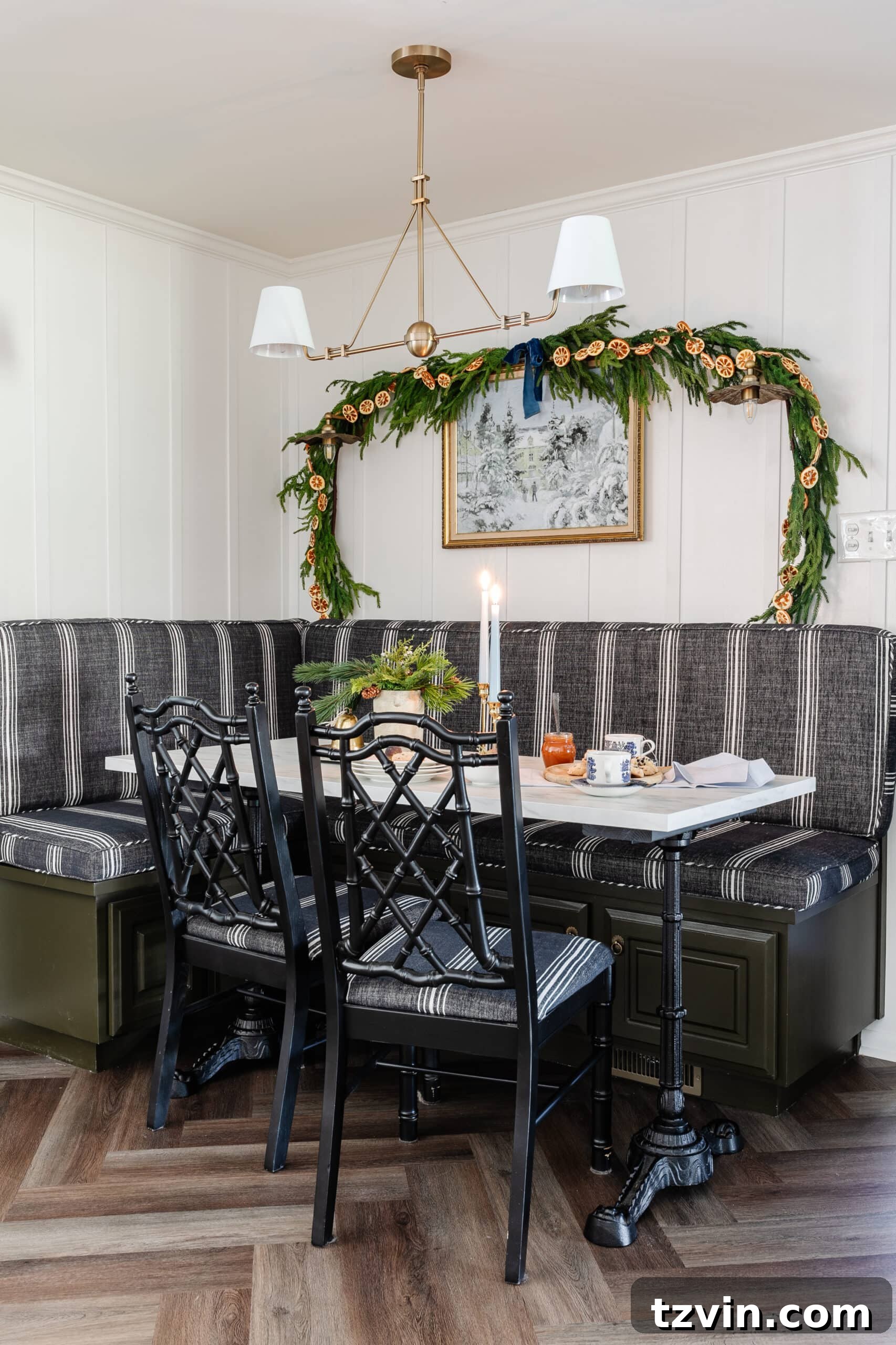 Instant Winter Art: Free Printable Decor 4 Elegant Christmas kitchen table setting featuring a festive garland and a serene winter scene art printable.