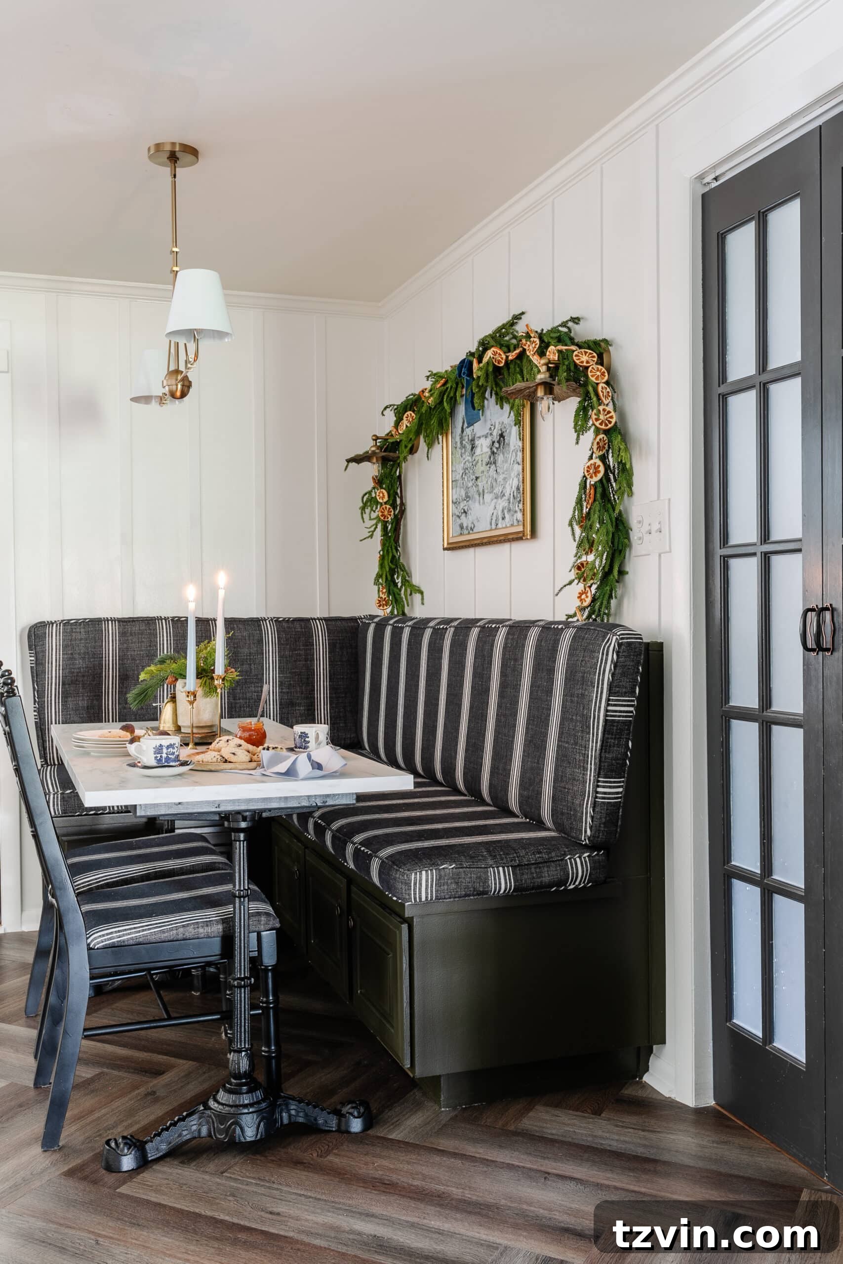 Instant Winter Art: Free Printable Decor 6 Cozy breakfast nook banquette and table adorned with festive Christmas decor, creating a warm and inviting space.