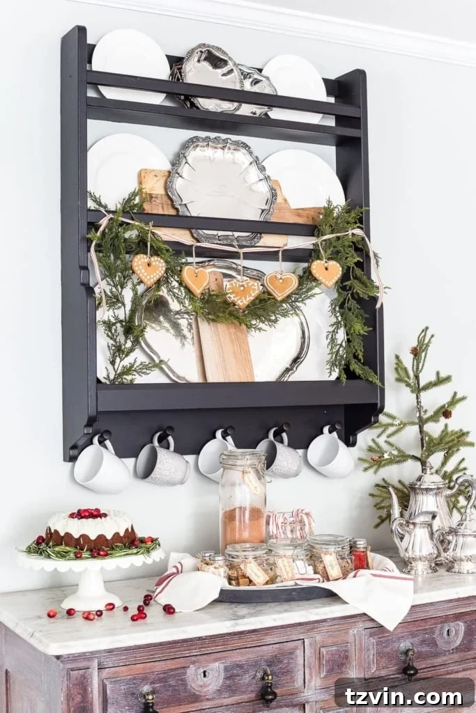 A beautifully decorated plate rack featuring festive garland and gingerbread cookies, styled with Scandinavian flair for Christmas
