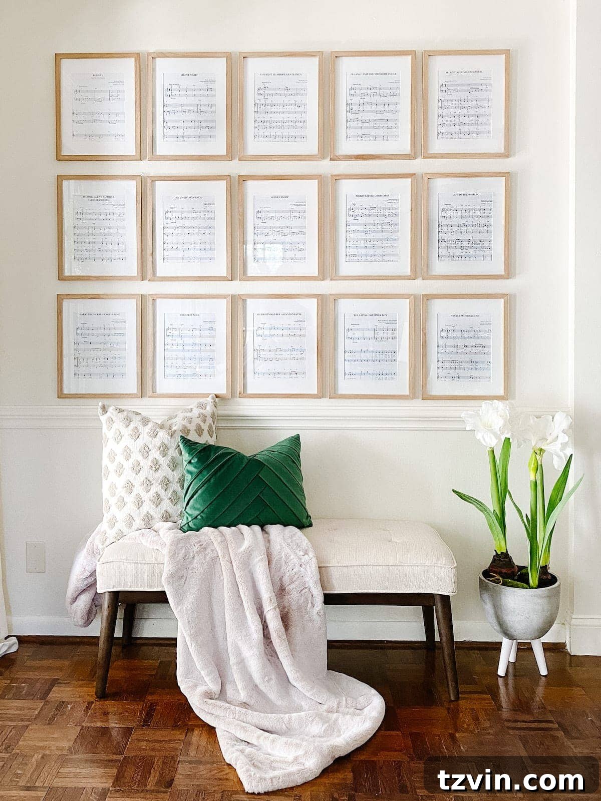 Christmas wall decor idea using a book of thrift store sheet music displayed in elegant gallery wall picture frames