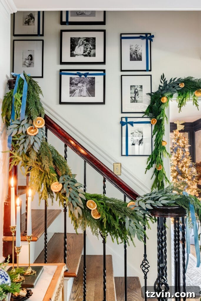 Charming Christmas wall decor idea using festive ribbon to adorn existing picture frames and artwork