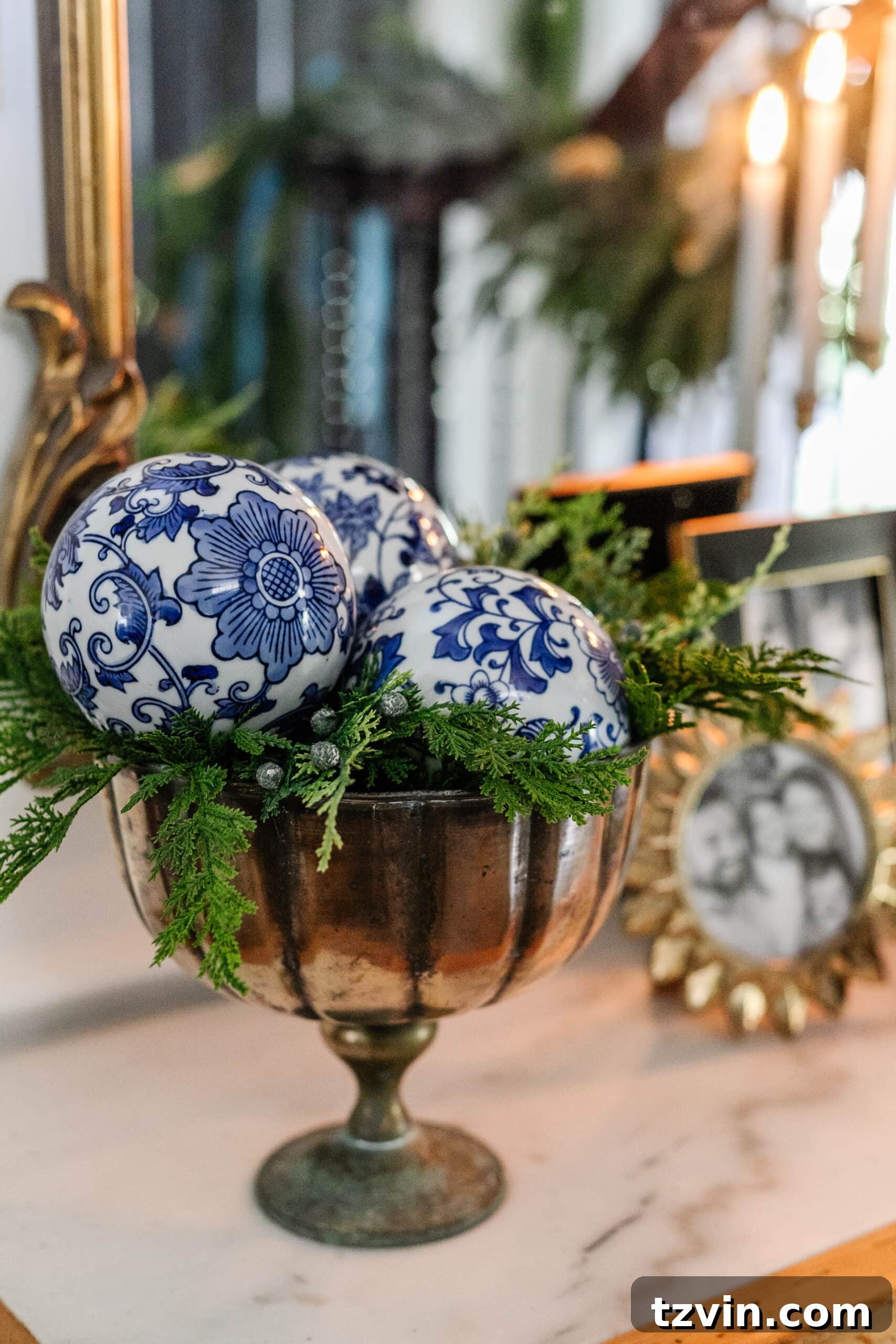 Sparkling Stairs and Welcoming Entryways: Your Garland Decor Guide 18 porcelain orbs in a footed bowl with greenery for blue and white Christmas decor