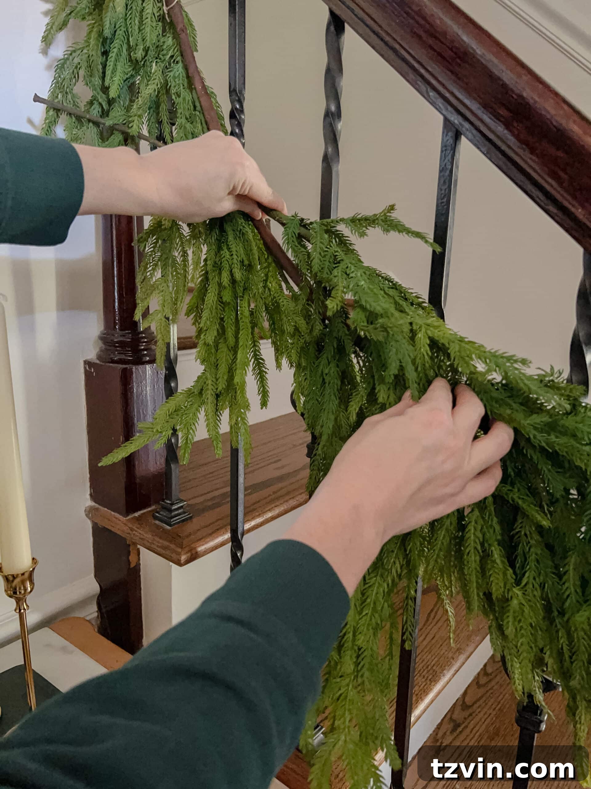 Sparkling Stairs and Welcoming Entryways: Your Garland Decor Guide 8 adding stems to garland to make it appear more full and realistic
