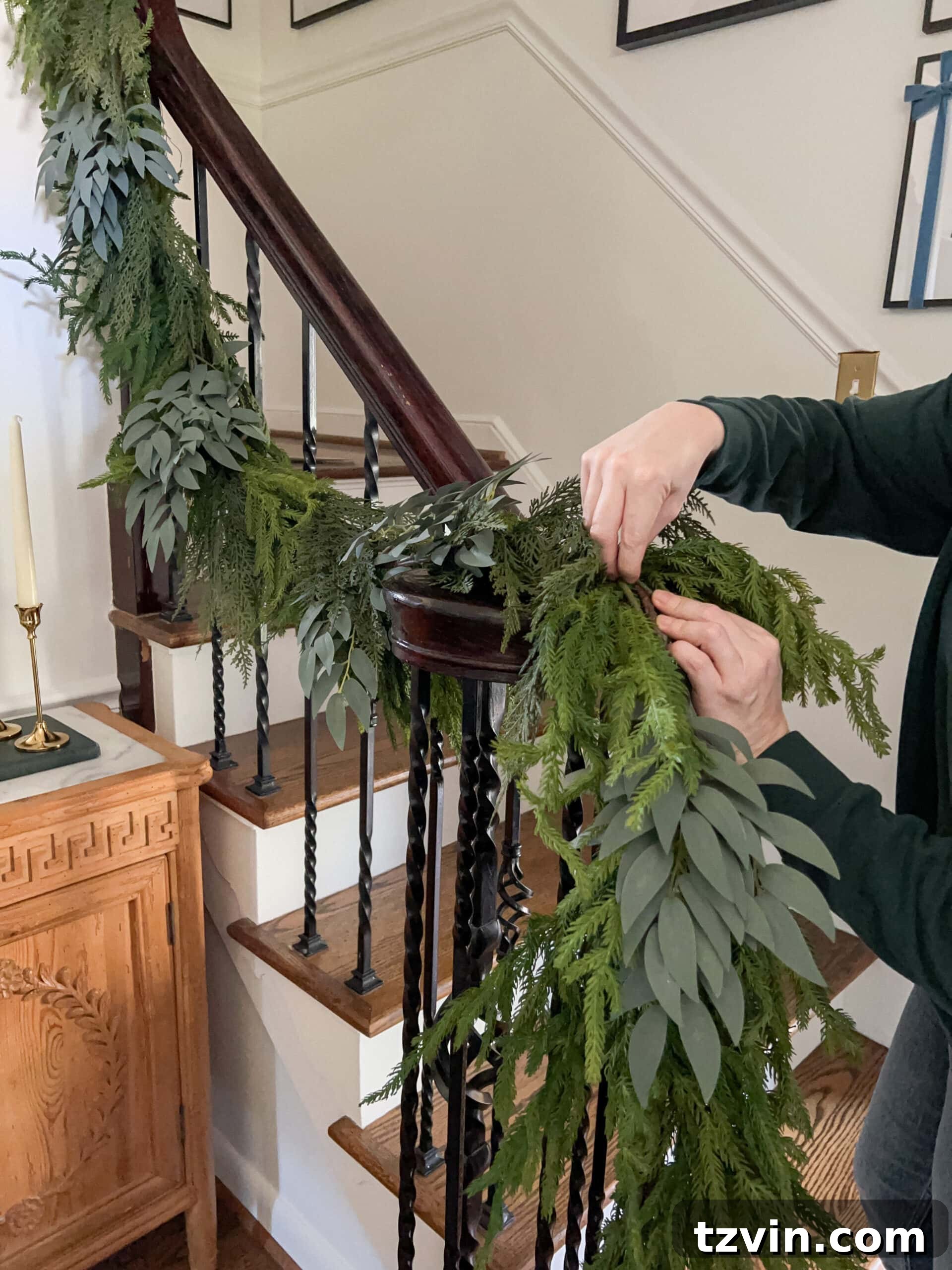Sparkling Stairs and Welcoming Entryways: Your Garland Decor Guide 9 mixing leafy stems into artificial garland to make it look real and vibrant