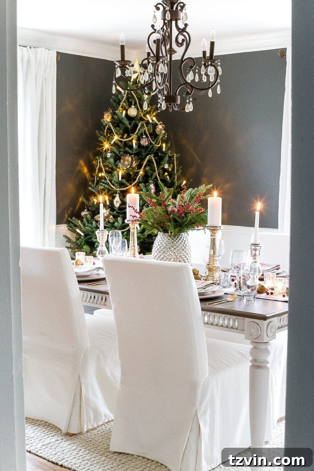 Festive Dining: White and Blue Christmas Inspiration 15 Real Christmas tree in a dining room decorated with mercury glass.