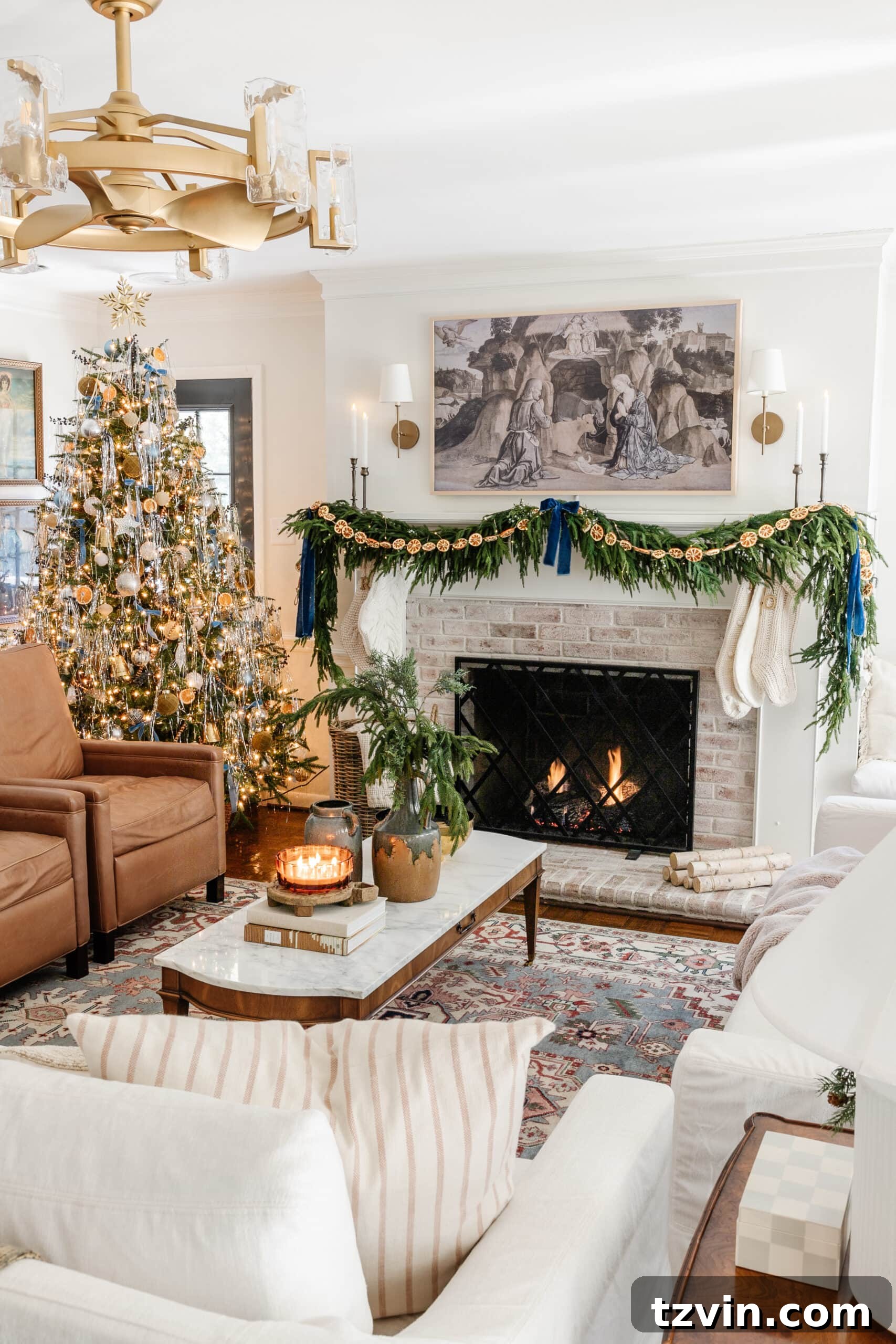Snuggle-Worthy: 13 Christmas Living Room Decor Inspirations 2 Living room decorated for Christmas with cozy candles and greenery