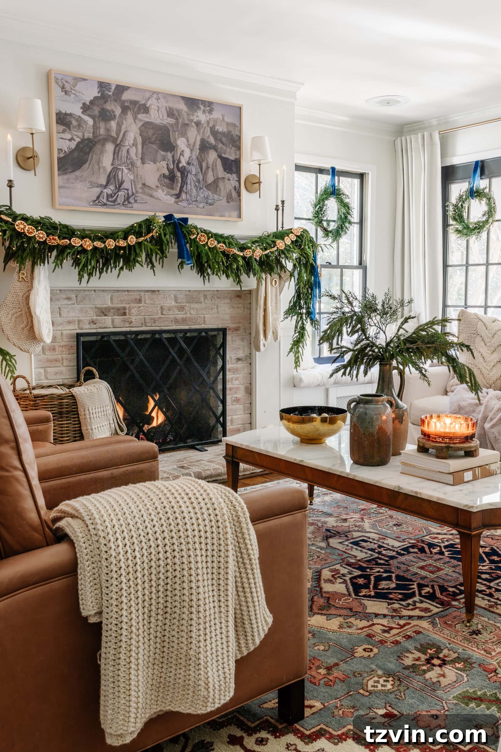 Snuggle-Worthy: 13 Christmas Living Room Decor Inspirations 5 sweater knit blanket on leather chair in living room decorated for Christmas