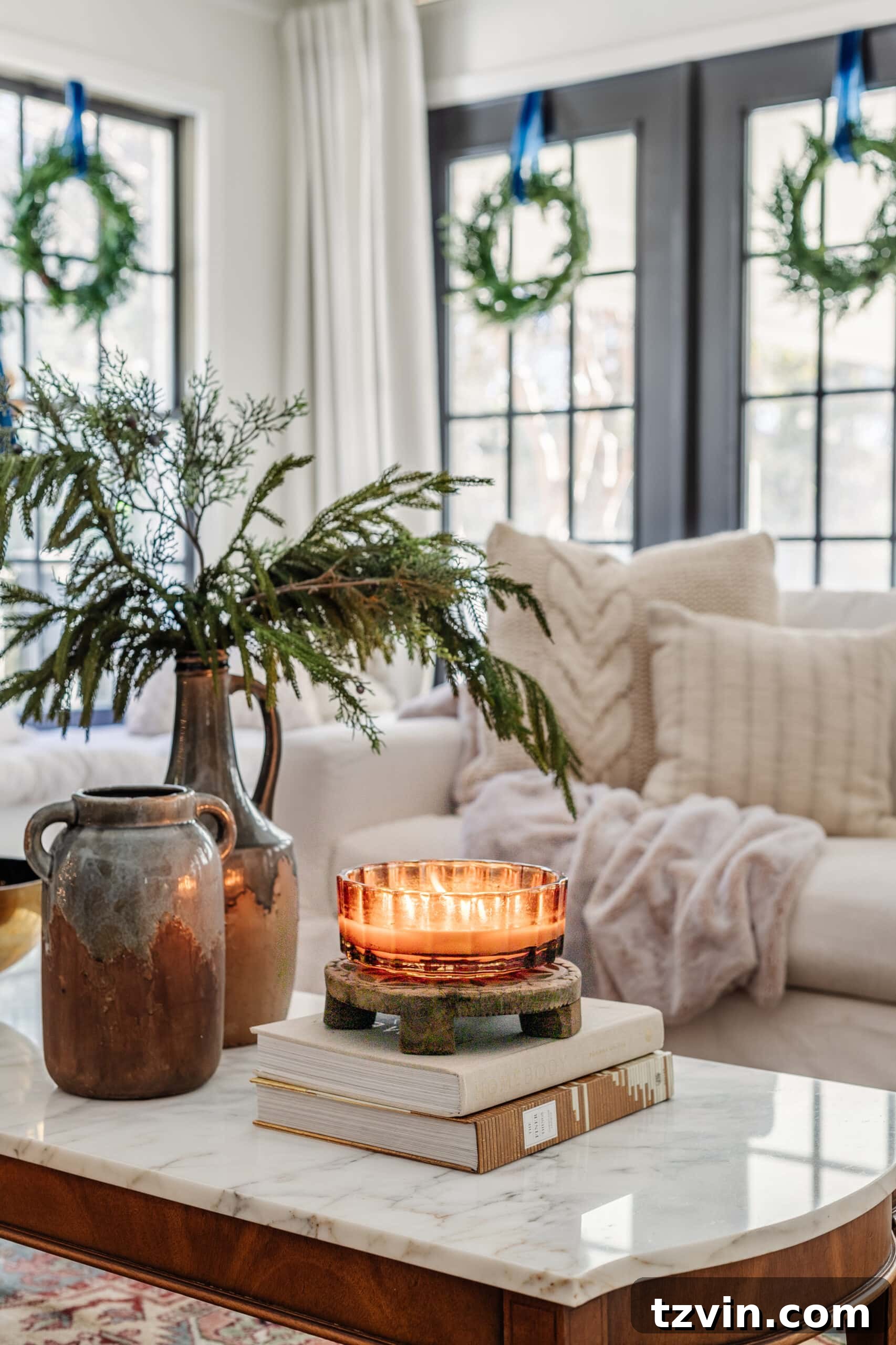 Snuggle-Worthy: 13 Christmas Living Room Decor Inspirations 7 candle and winter decor on coffee table