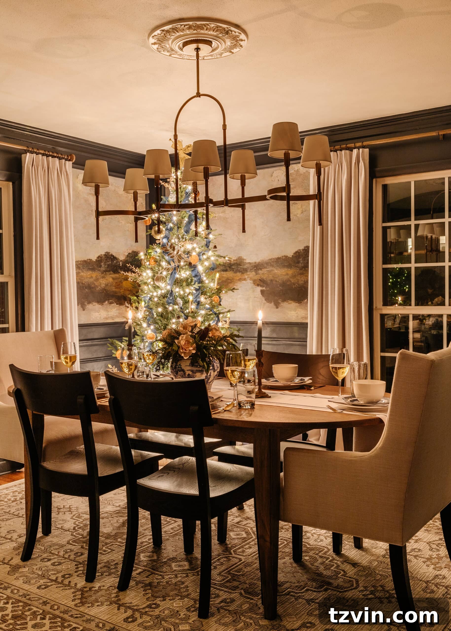 A camera tripod with a DSLR setup, aimed at a cozy Christmas living room scene, ready for night photography.