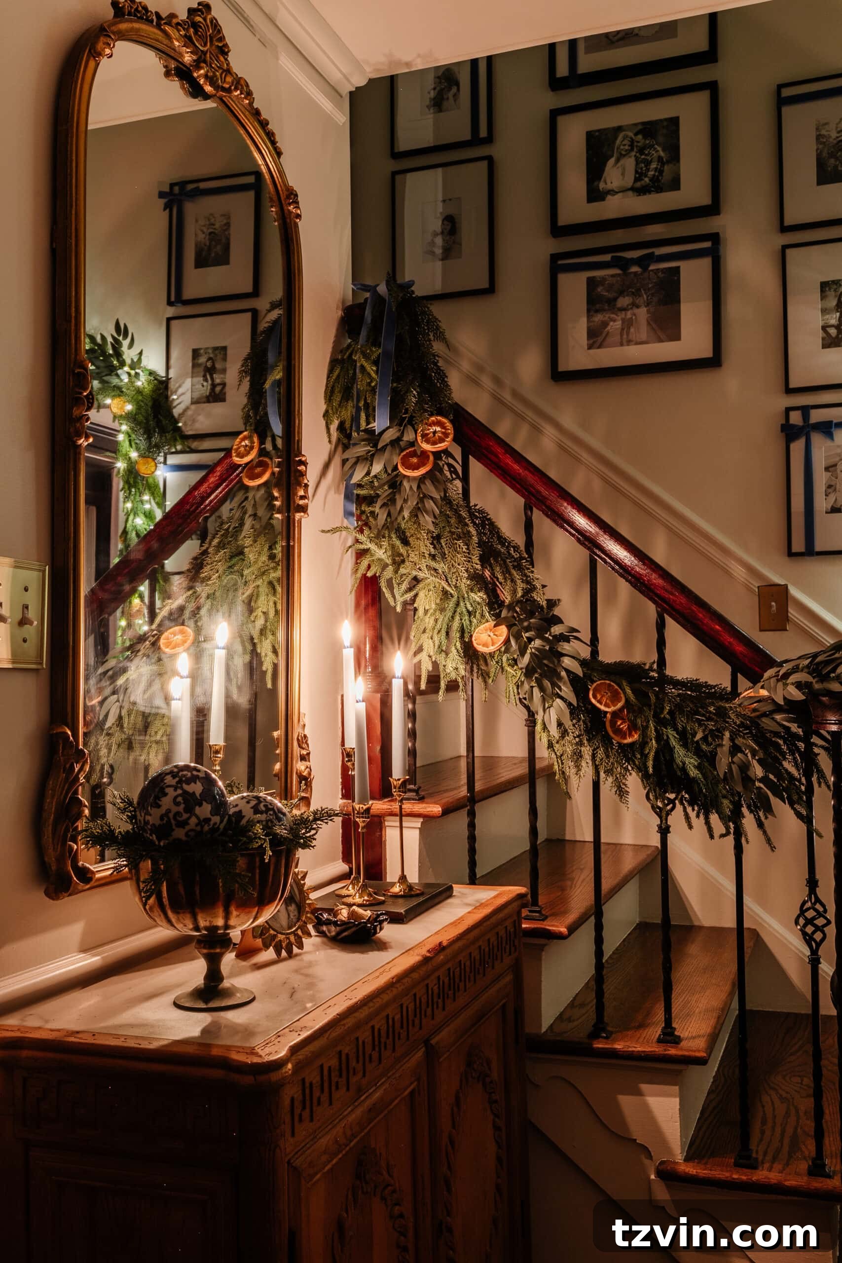 An illuminated Christmas tree and fireplace mantel create a festive scene in a dimly lit living room, captured with expert low-light techniques.
