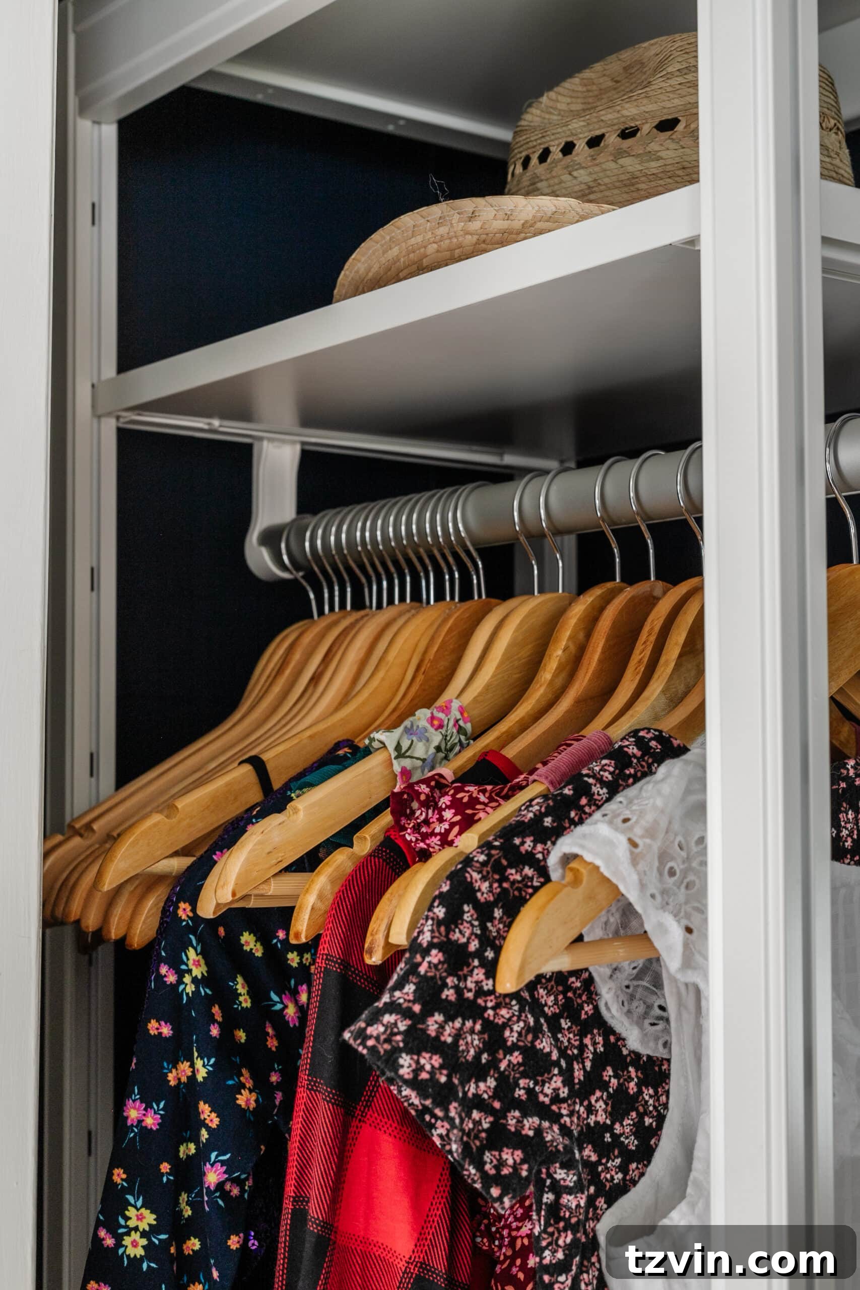 Petite Wardrobe Perfection: 10 Organizing Hacks for Girls 13 matching wooden hangers on a rod to minimize clutter and create visual order