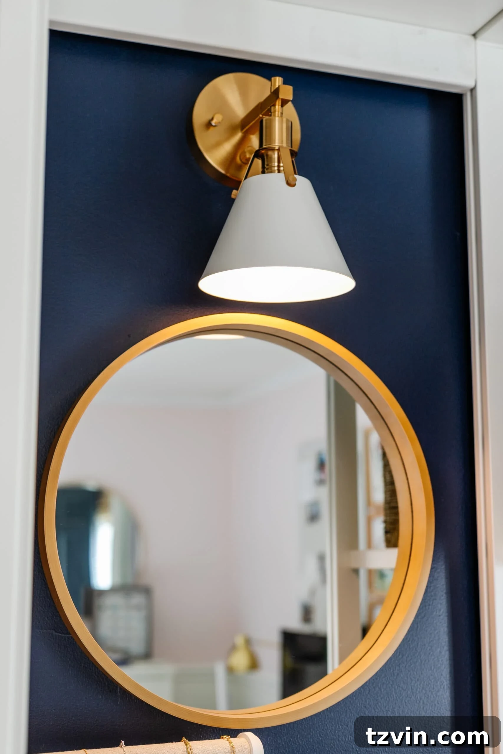 Petite Wardrobe Perfection: 10 Organizing Hacks for Girls 8 closet lighting using a sconce with battery puck light over a mirror for enhanced visibility