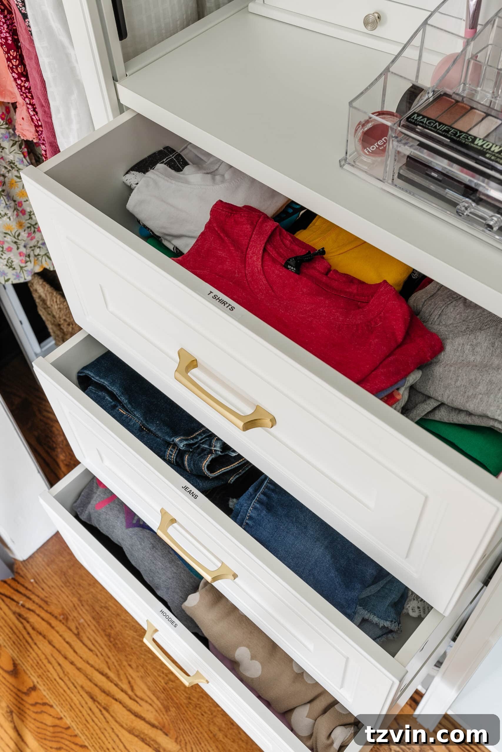 Petite Wardrobe Perfection: 10 Organizing Hacks for Girls 9 organized closet drawers with labels for clothing categories, enhancing tidiness