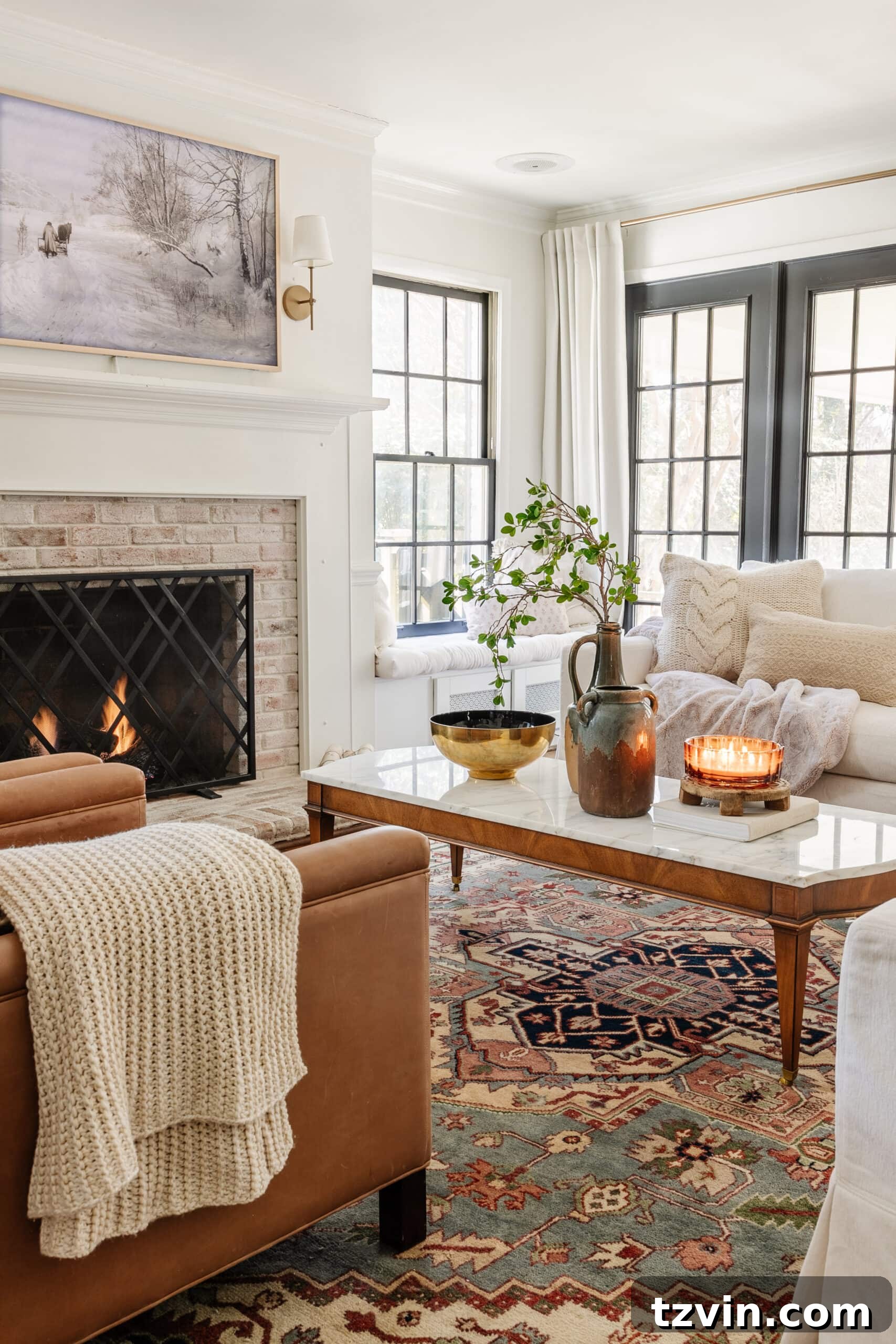 January living room winter decor with simple fireplace, snow art, and chunky blankets