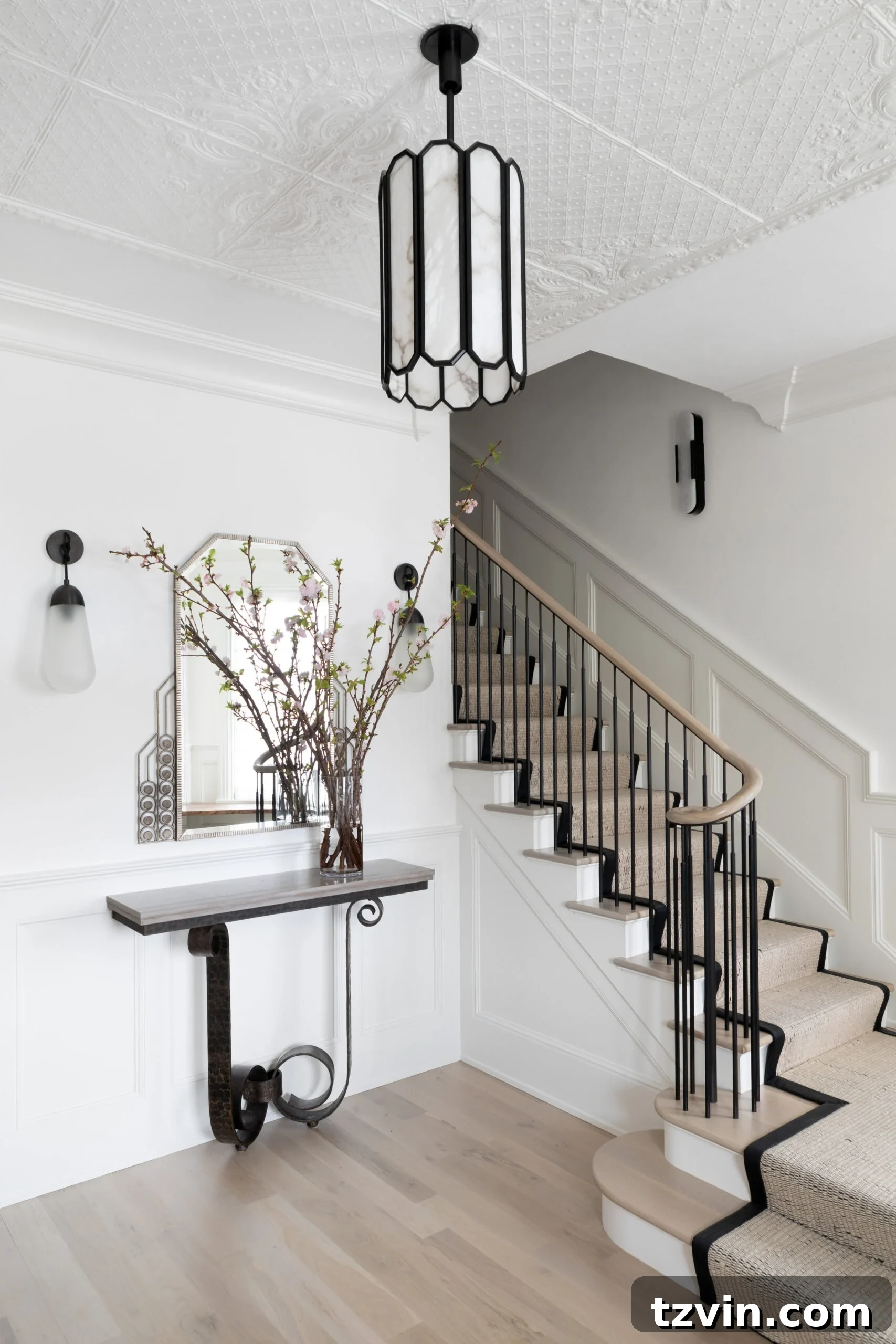 Black Stair Railing Ideas for a Dramatic Entry 5 elegant entryway staircase with wood handrail and simple black balusters