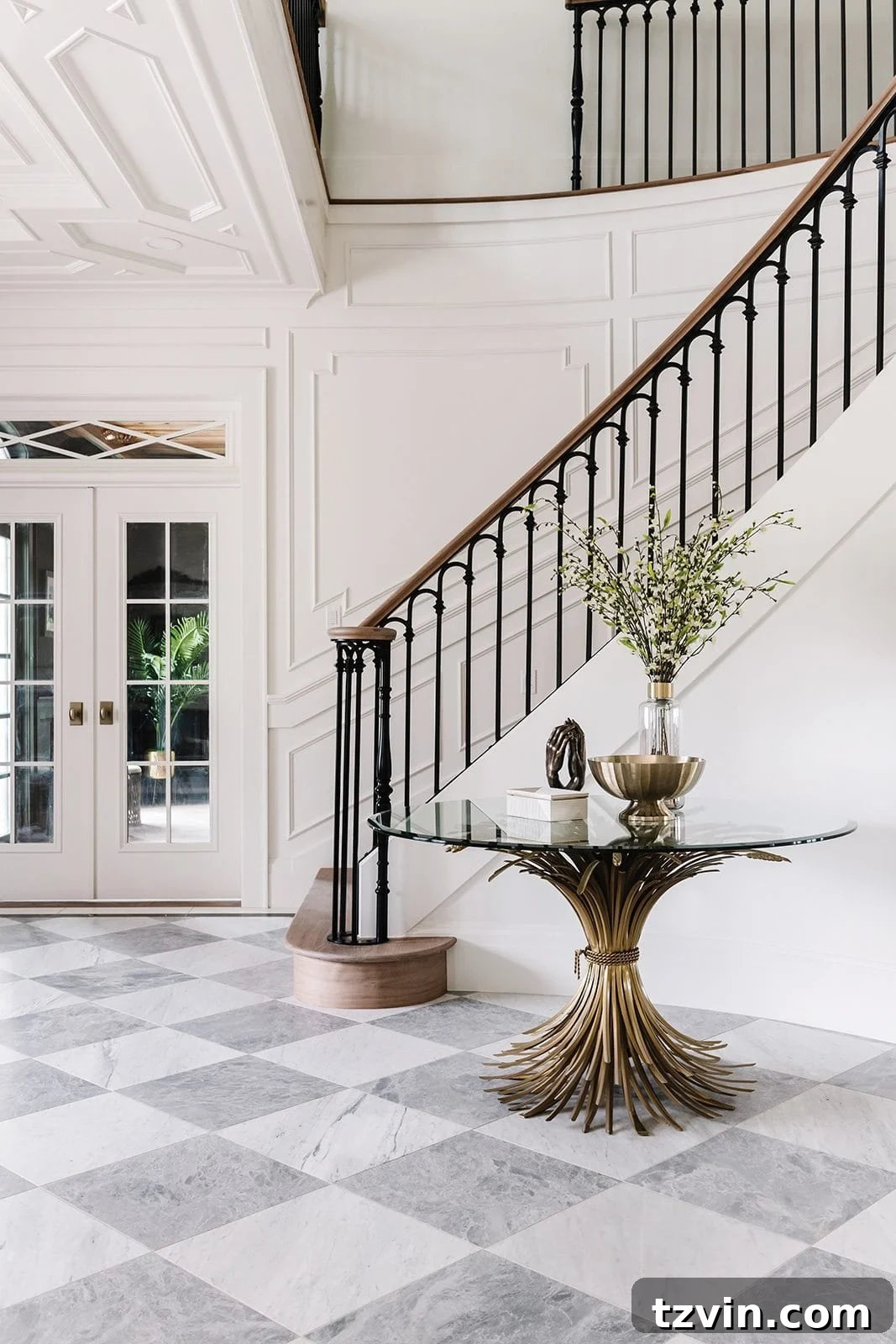 Black Stair Railing Ideas for a Dramatic Entry 6 entryway staircase with wood handrail and black scalloped balusters