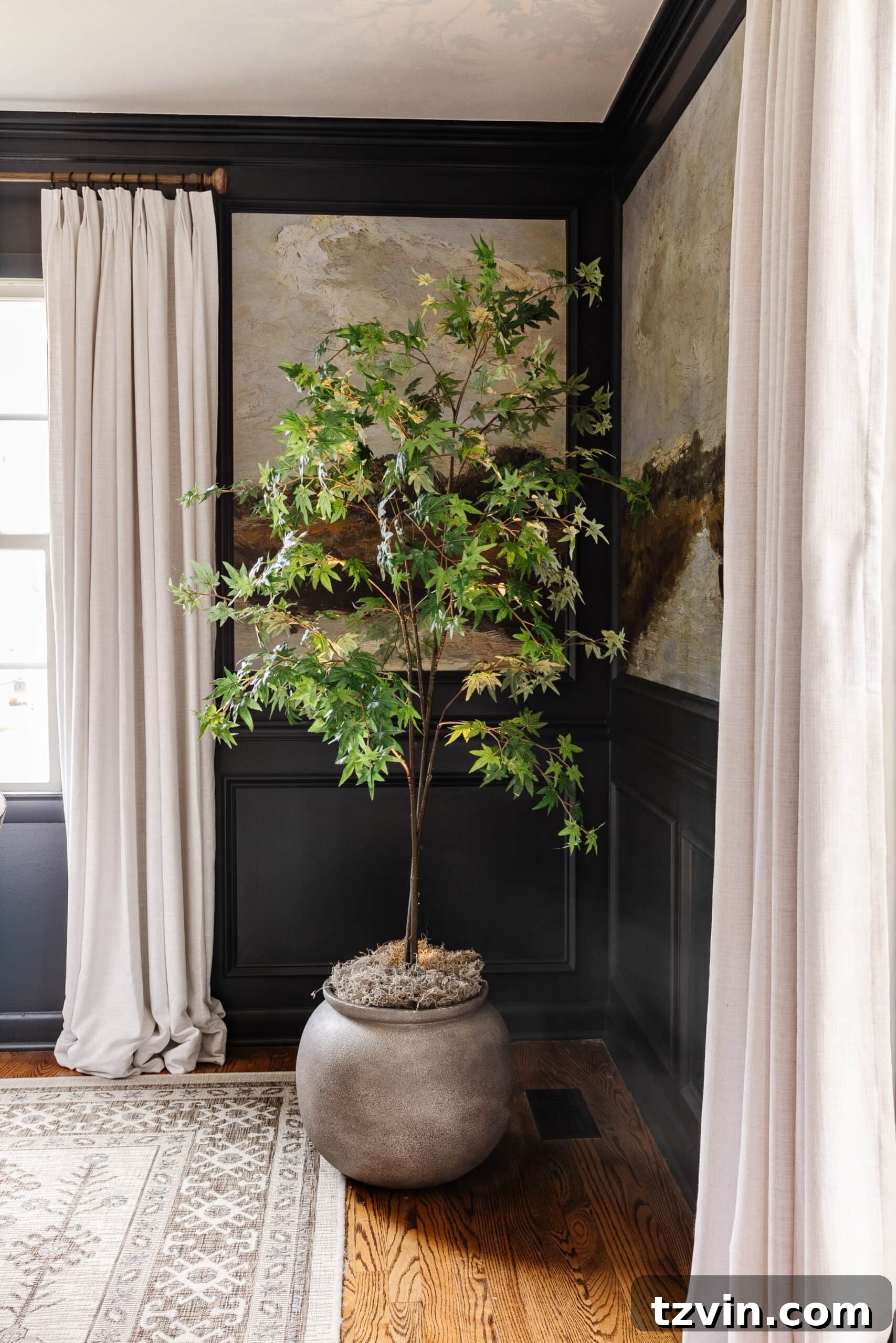 Beyond Plastic: Making Your Artificial Indoor Trees Look Naturally Real 10 faux indoor tree in large planter with moss and uplight