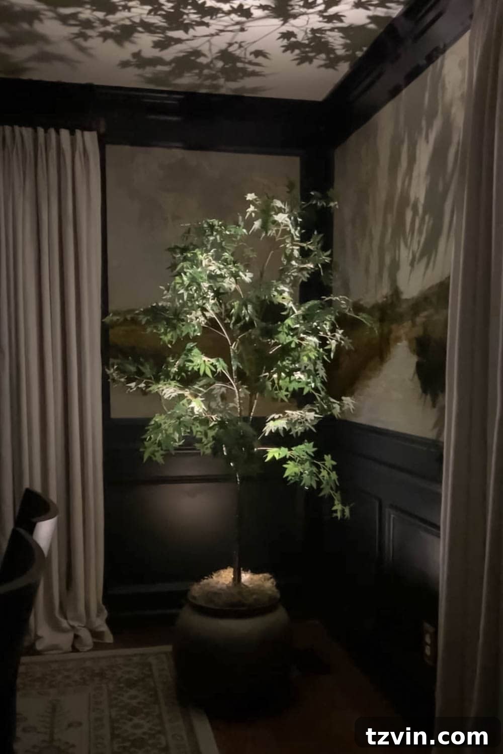 Beyond Plastic: Making Your Artificial Indoor Trees Look Naturally Real 9 spotlight at an artificial indoor tree at night