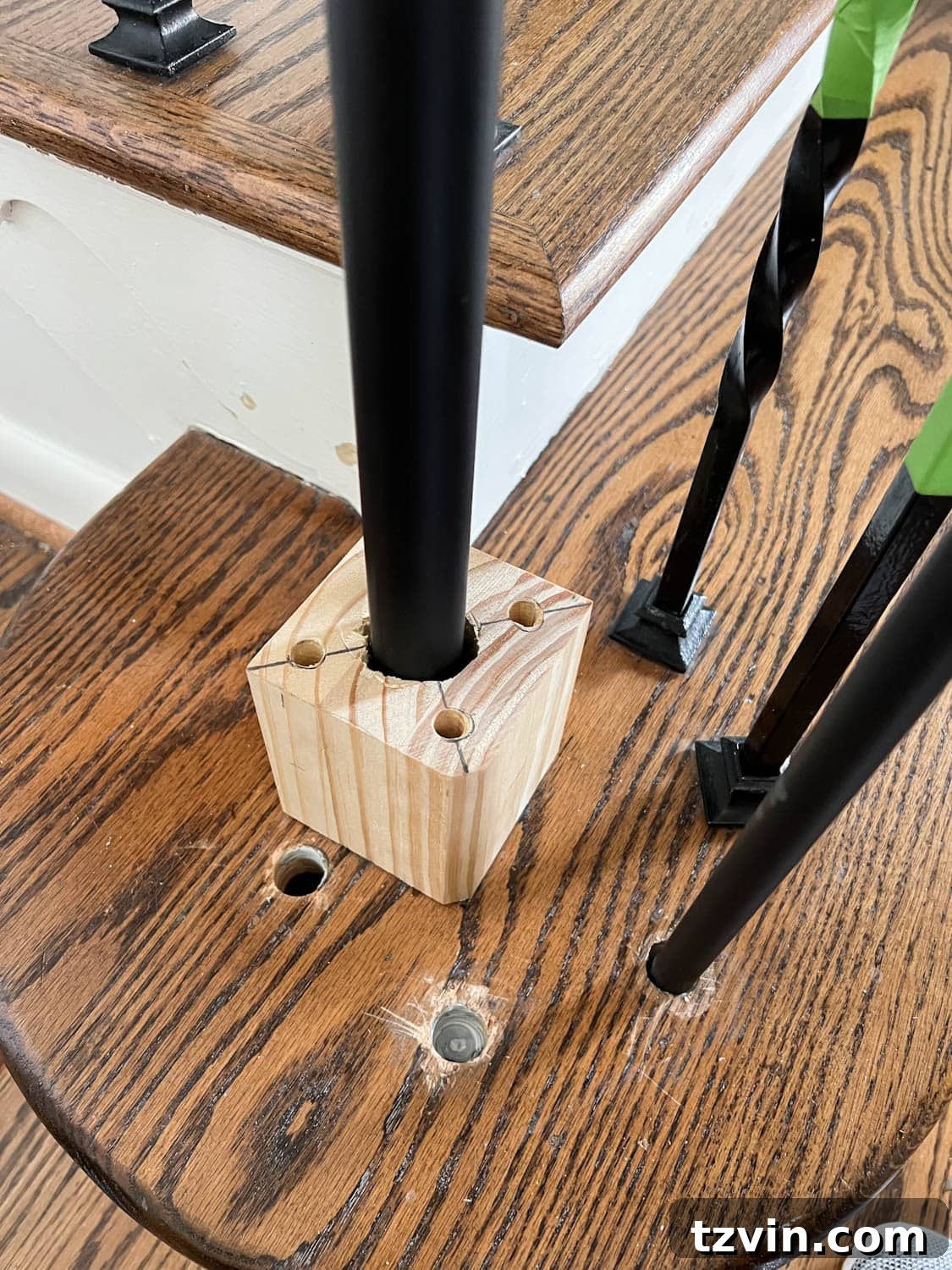 Revamp Your Stairs: DIY Spindle Replacement 21 replacing a new post on a wood block mount