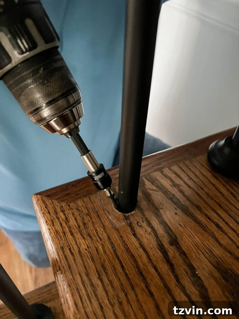Revamp Your Stairs: DIY Spindle Replacement 28 drilling screw in stair tread to secure stair baluster