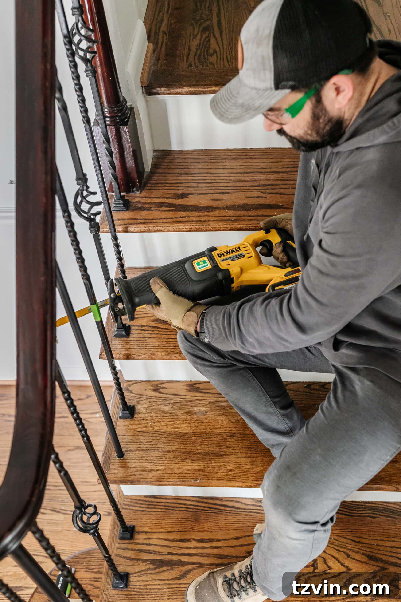 Revamp Your Stairs: DIY Spindle Replacement 4 cutting wrought iron stair spindles with a reciprocating saw